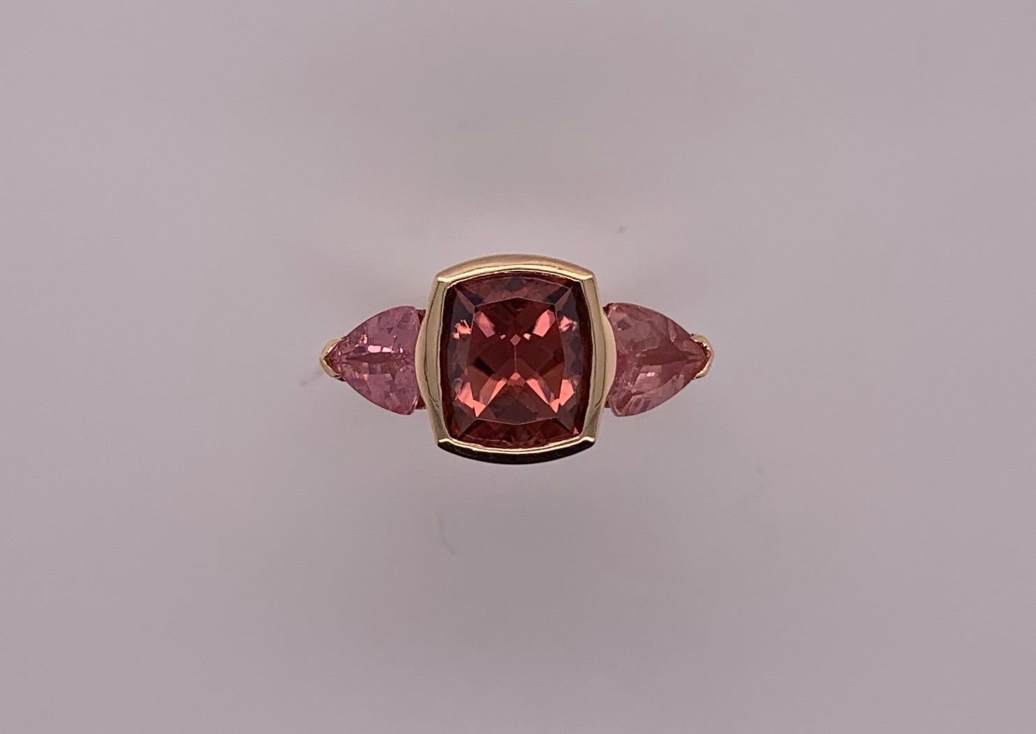 Custom design - Rose gold with natural Zircon and Spinel. This Vance Design is one of a kind, The Zircon is a chambord colored 7.01 carat cushion cut. The spinels are a matched pair of trillion cut pink stones weighing 2.26 carats. We call it our