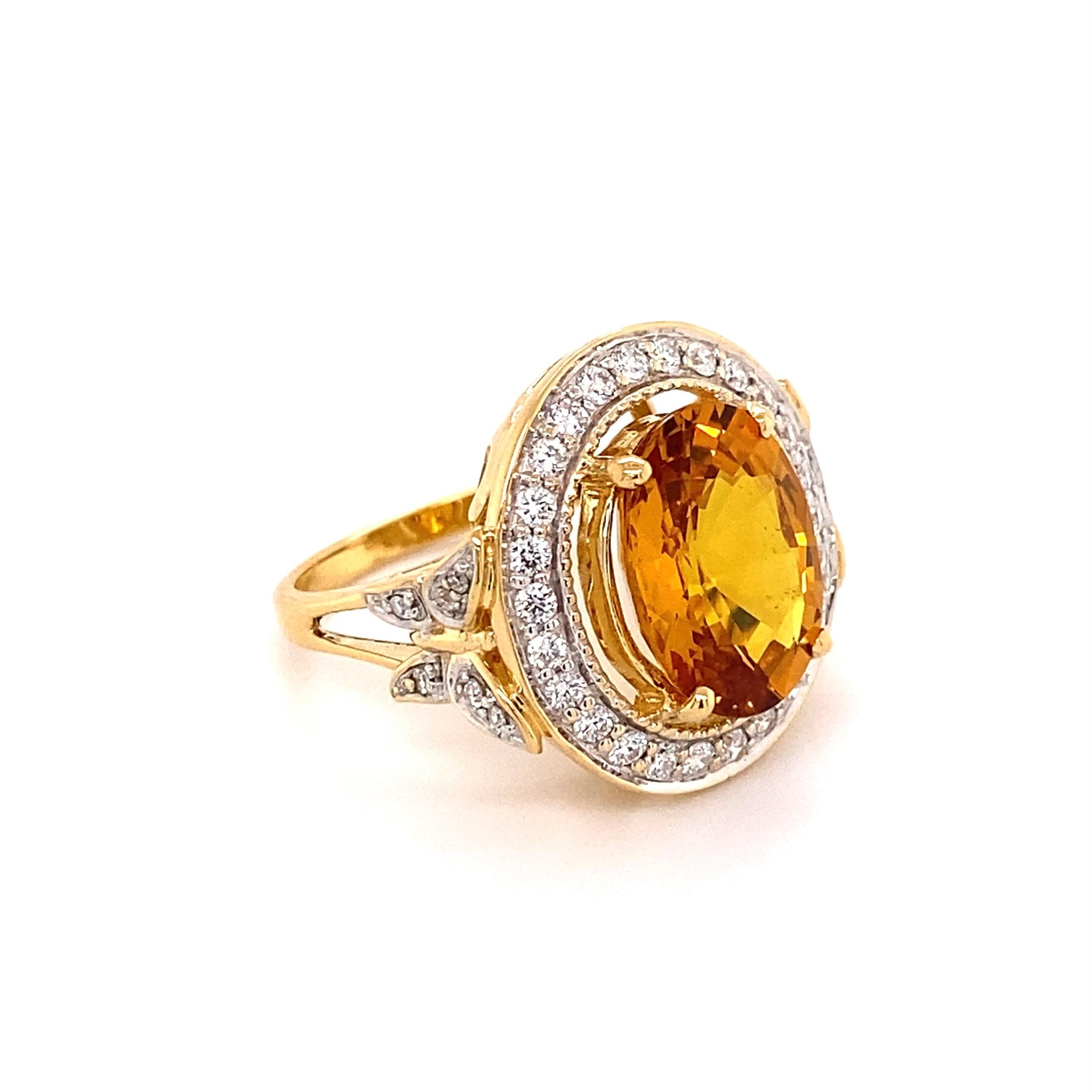 Simply Beautiful! Vivid Orange Yellow Natural Sapphire and Diamond Ring. Center securely Hand set with an Oval Yellow Sapphire weighing 7.01 Carat. Amazing color! A Carte Blu Lab report #46080023. Surrounded by Diamonds approx. 0.55tcw. Hand crafted
