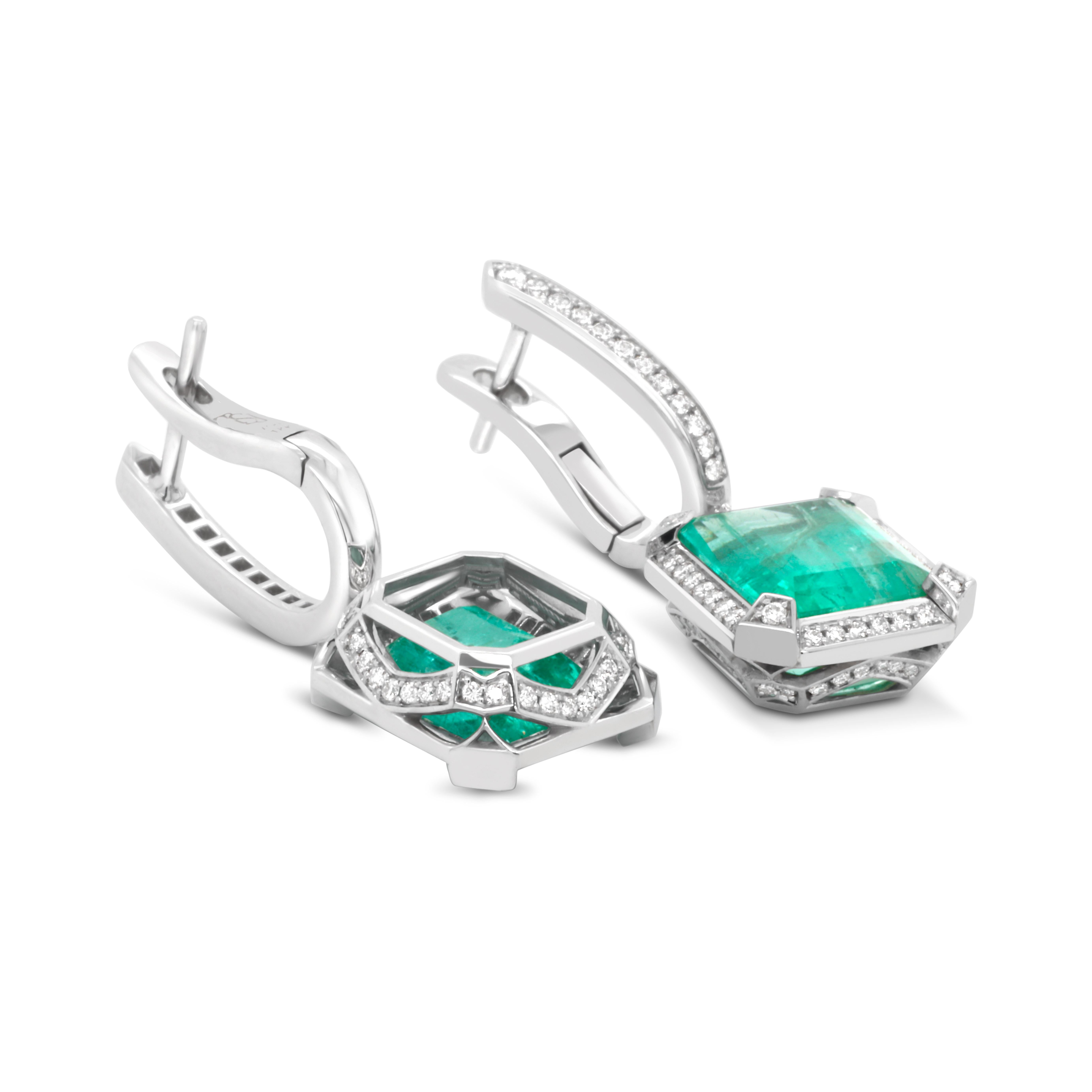 Classic 18K White Gold Earrings. Center stones are pleasing certified no-oil Russian Emeralds 7.01 ct surrounded by White Diamonds 0.76 ct total weight. Timeless design and absolute perfection.
This Earrings are perfectly combined with 5.28 ct
