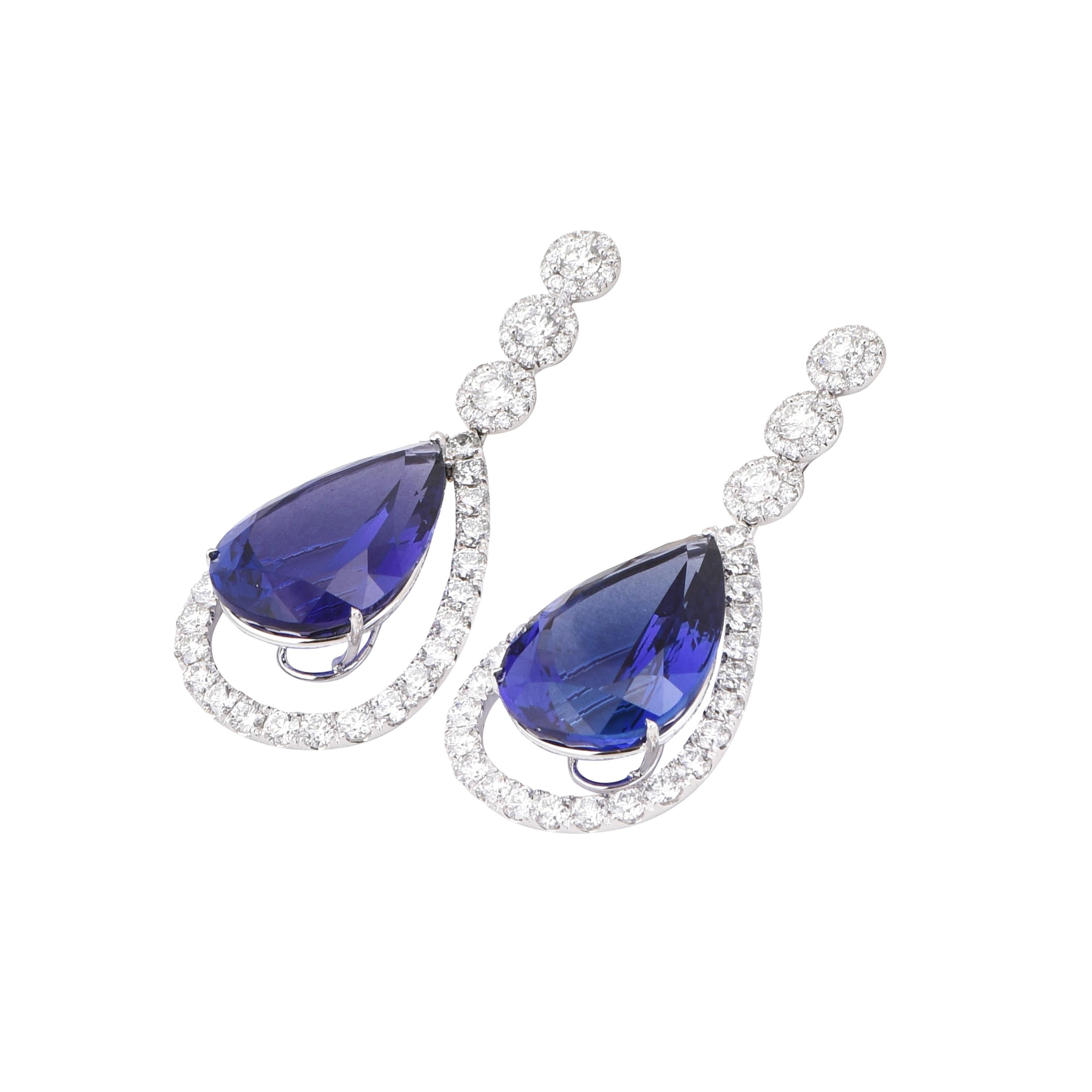 A pair of outstanding 18 karat white gold tanzanite drop earrings from the Ultramarine collection of Laviere. The earrings, certified by IGI, are set with two pear shape tanzanites weighing a total of 70.12 carats and 9.31 carats round brilliant