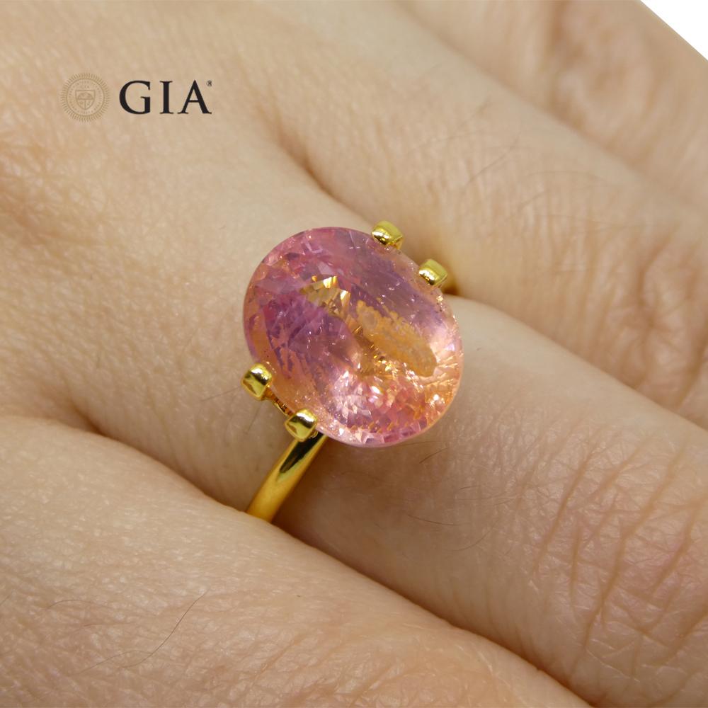 The GIA report reads as follows:

GIA Report Number: 2225341603
Shape: Oval
Cutting Style:
Cutting Style: Crown: Modified Brilliant Cut
Cutting Style: Pavilion: Step Cut
Transparency: Transparent
Color: Pink-Orange

 

RESULTS
Species: Natural