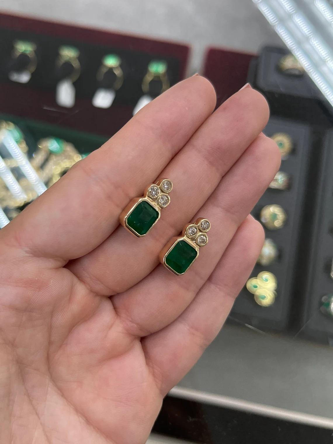 Modern 7.01tcw 14K Dark Emerald-Emerald Cut & Diamond Accent Gold Bezel Stud Earrings For Sale