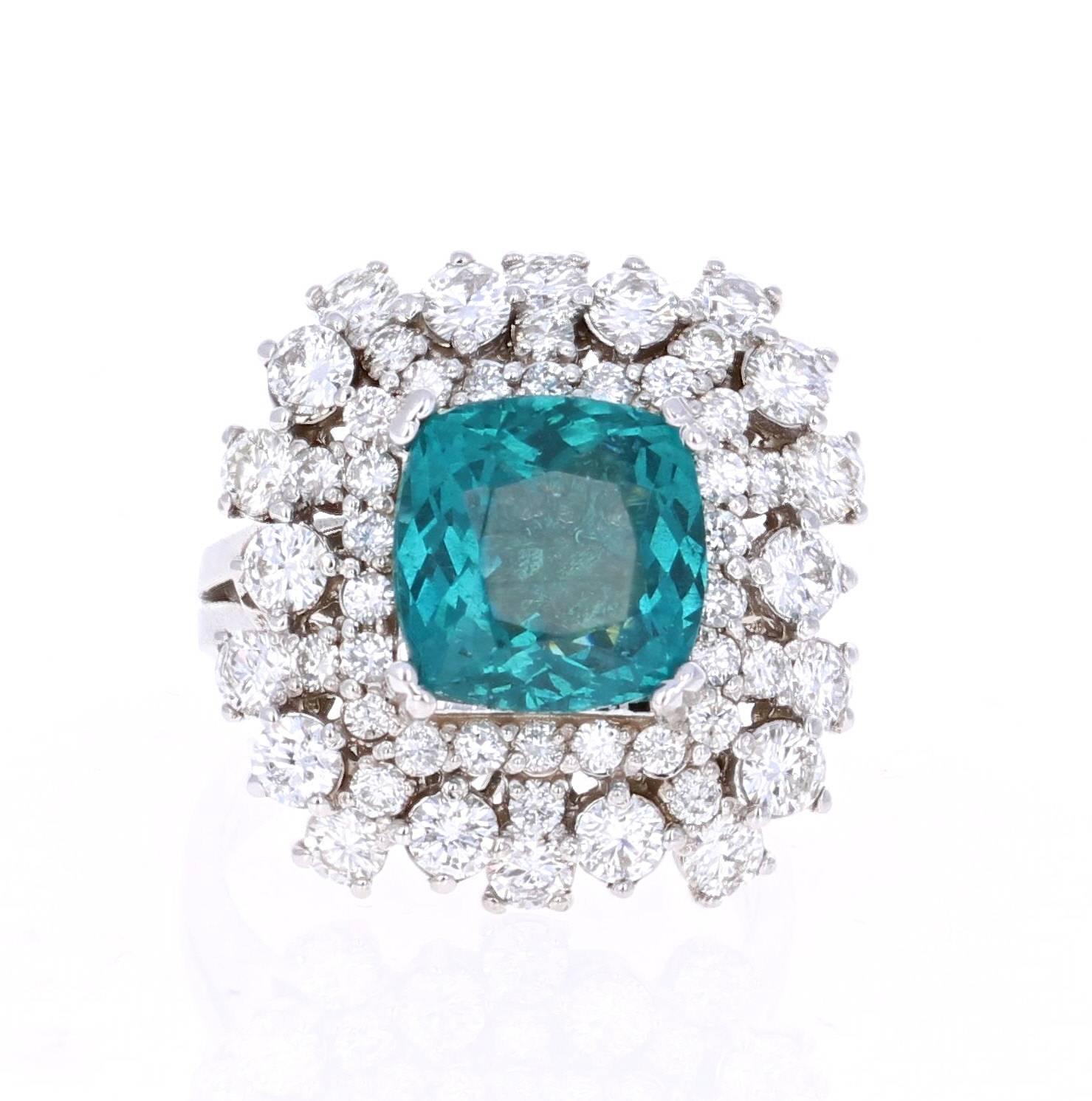 Stunning 7.02 Carat Apatite Diamond White Gold Cocktail Ring that is sure to elevate your accessory collection!

The ring has a 4.68 Carat Apatite set in the center of the ring surrounded by 52 Round Cut Diamonds that weigh 2.34 carats.  The total
