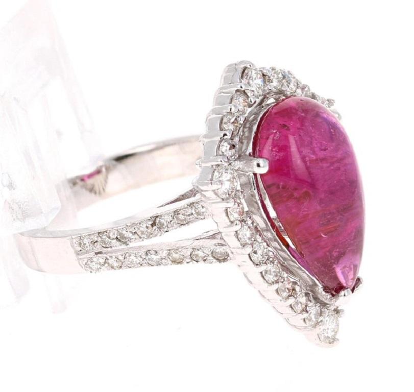 Cabochon Tourmaline Diamond White Gold Cocktail Ring

This beauty has a Pear Cut Cabochon Pink Tourmaline that weighs 5.95 Carats.  It is surrounded by 52 Round Cut Diamonds that weigh 1.07 Carats, with a clarity and color of VS-H. The total carat