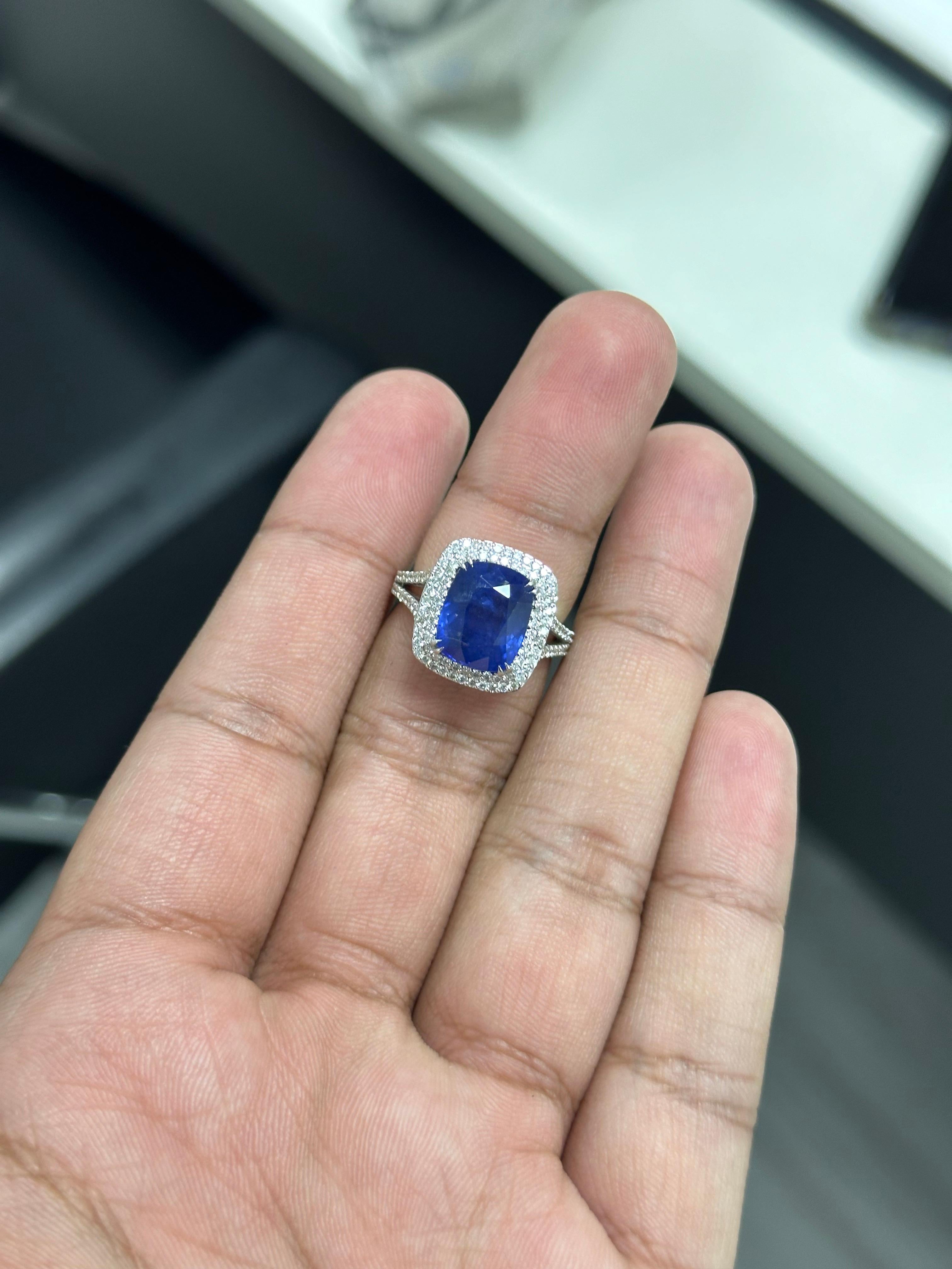 Introducing our exquisite 18K White Gold Sapphire Ring, a true statement of luxury and elegance. This magnificent piece features a stunning 7.02 carat cushion Sapphire sourced from Sri Lanka, known for its exceptional quality and captivating royal