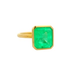 7.03 Carat Emerald 18K Yellow Gold Solitaire Bezel Ring