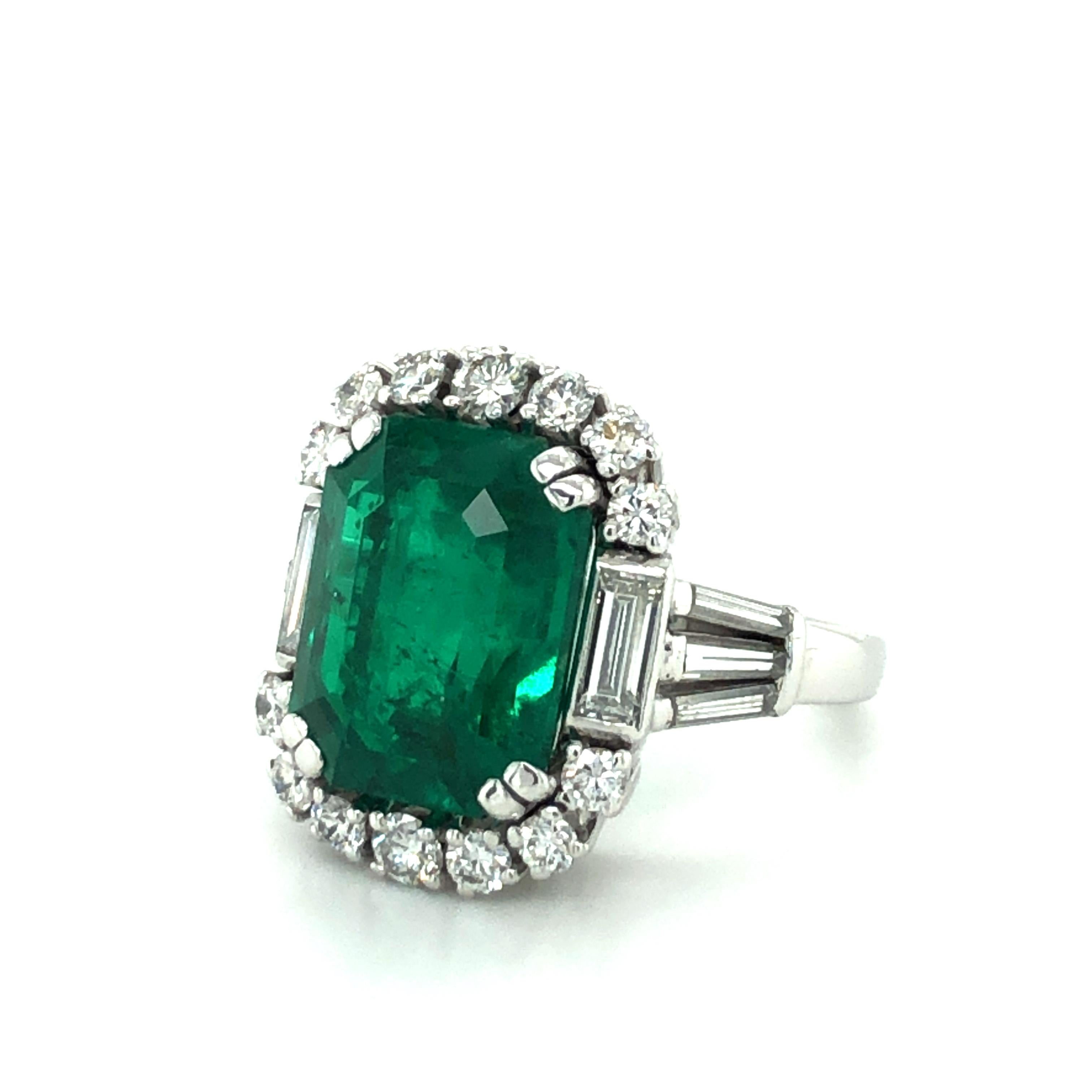 Contemporary 7.03 Carat Colombian Emerald and Diamond Ring in 18 Karat White Gold