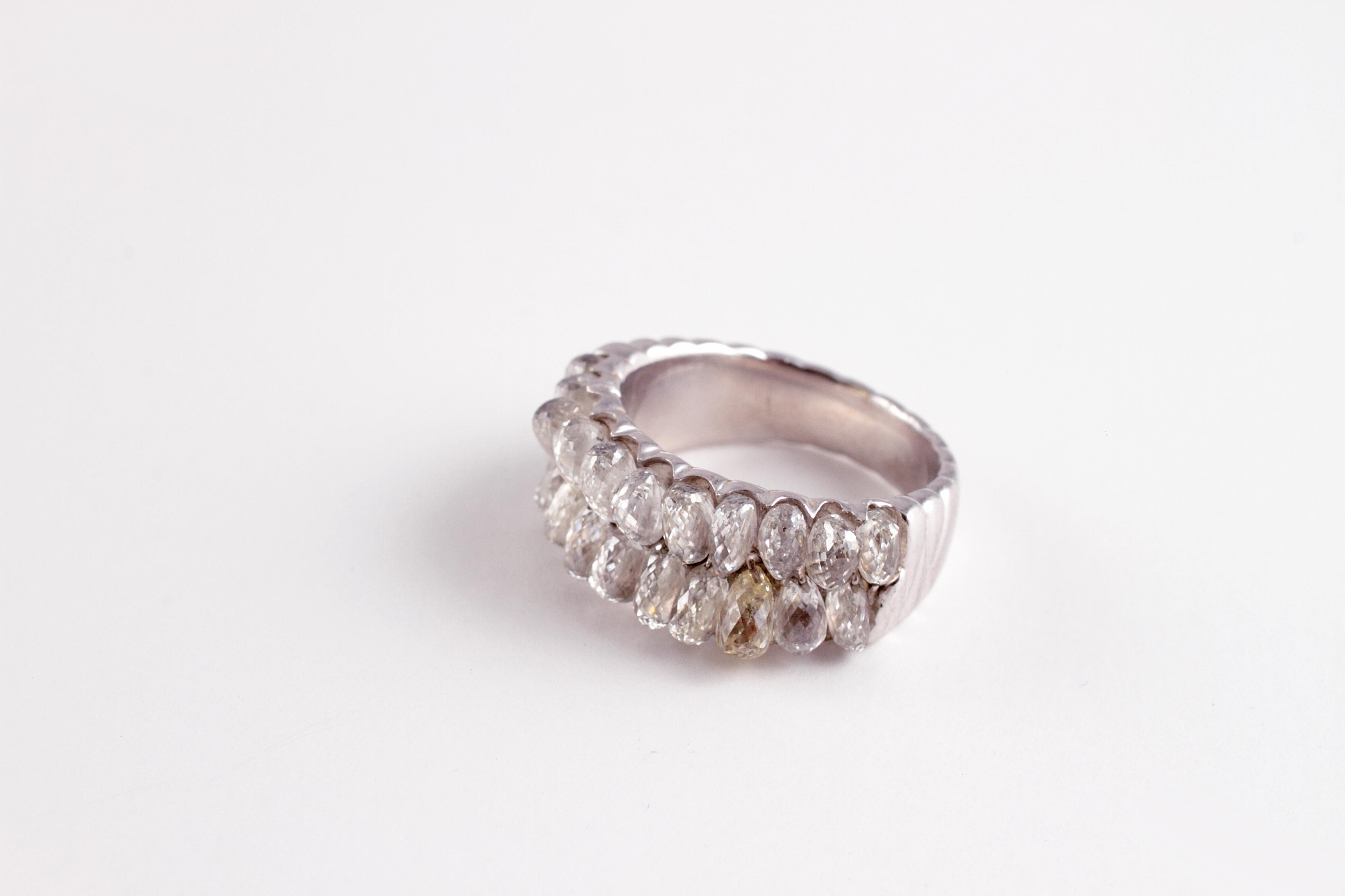 Purchased from A. B. Levy out of a Florida estate, this stunning and unusual ring is in platinum and supports over 7.00 carats of briolette-cut diamonds.  Size 6 1/2