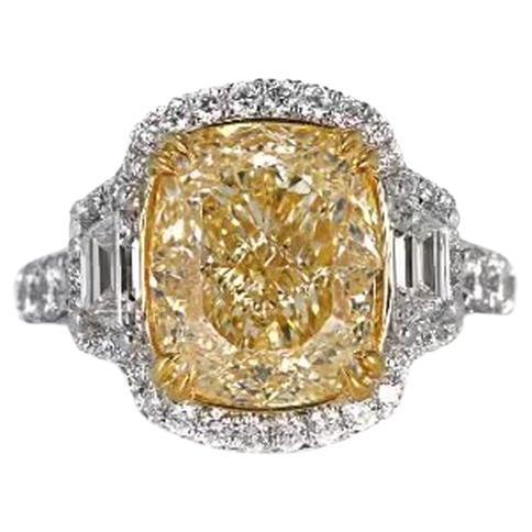 This EGL Certified handcrafted diamond ring features a captivating 7.05 Carats Natural Fancy Intense Yellow diamond. with a total diamond weight of 9.33 Carats.
The stunning diamond is mounted on 18K Yellow Gold 4 prong setting with 18K White Gold