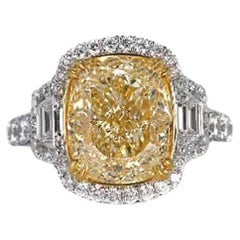 EGL Certified 7.05 Carat Fancy Intense Yellow SI1 Cushion Cut Halo Diamond Ring