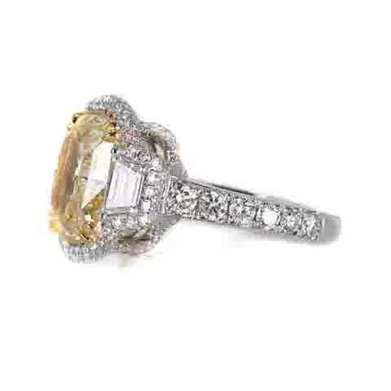 Art Deco EGL Certified 7.05 Carat Fancy Intense Yellow SI1 Cushion Cut Halo Diamond Ring For Sale