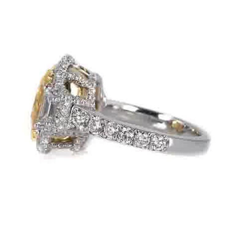 EGL Certified 7.05 Carat Fancy Intense Yellow SI1 Cushion Cut Halo Diamond Ring In New Condition For Sale In New York, NY