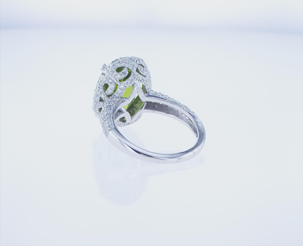 Modern 7.05 Carat Oval Peridot Cocktail Ring in 18k White Gold with Palladium For Sale