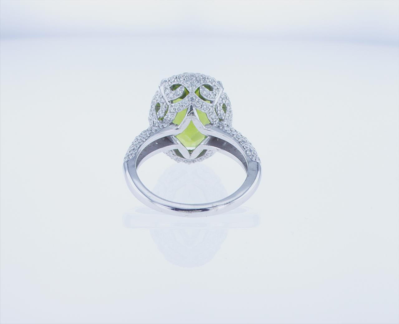 Oval Cut 7.05 Carat Oval Peridot Cocktail Ring in 18k White Gold with Palladium For Sale