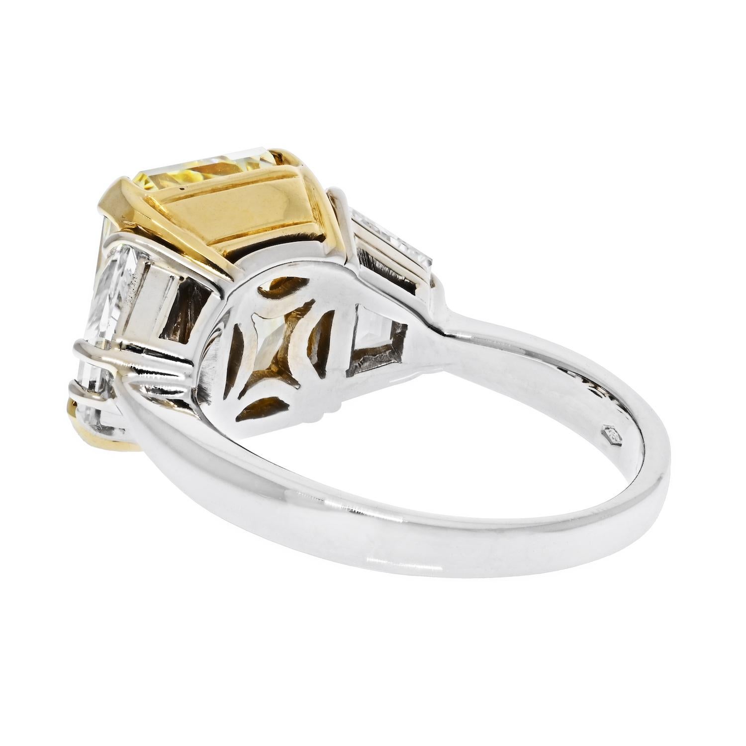 7.05 Carat Radiant Cut Fancy Yellow GIA VS2 Three Stone Diamond Engagement Ring.

Three stone diamond engagement ring crafted in platinum and 18k yellow gold, mounted with a 7.05 carat Radiant Cut Fancy Yellow Diamond. It is GIA certified as Fancy