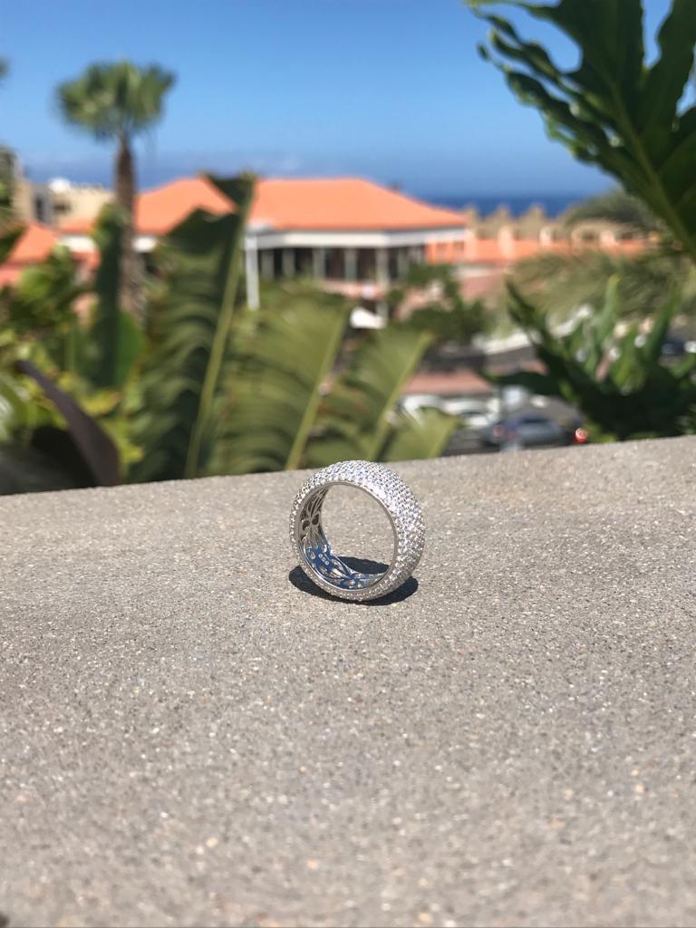 This 9mm wide band absolutely dazzles with 7.05 carat of the highest quality micro-set round brilliant cut cubic zirconia in perfect formation all the way around.

The design is both bold and dramatic, yet smooth to the touch and comfortable enough
