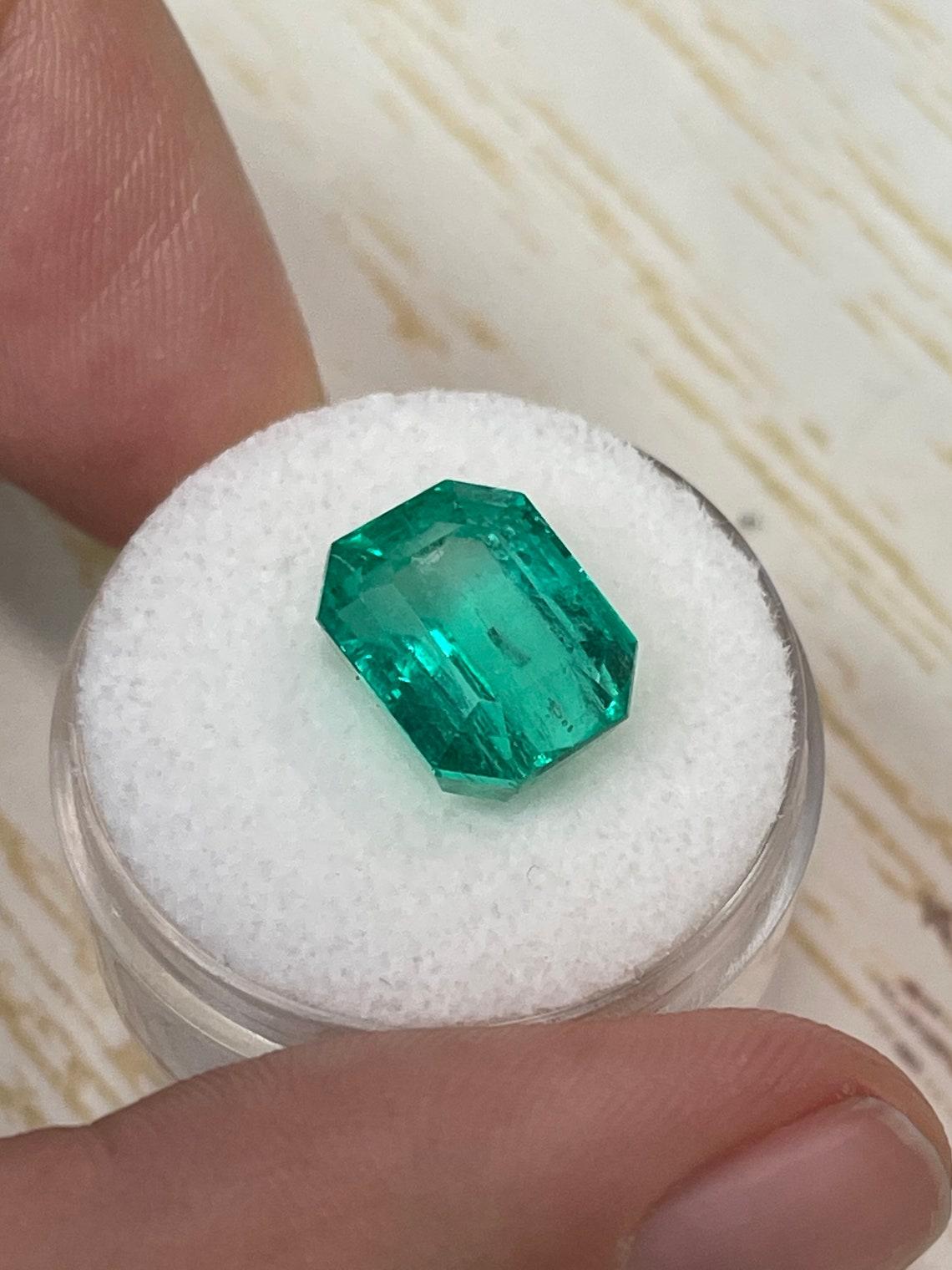 7.06 Carat 12x9.5 Glowing Bluish Green Colombian Emerald - Emerald Cut Muzo Mine In New Condition For Sale In Jupiter, FL