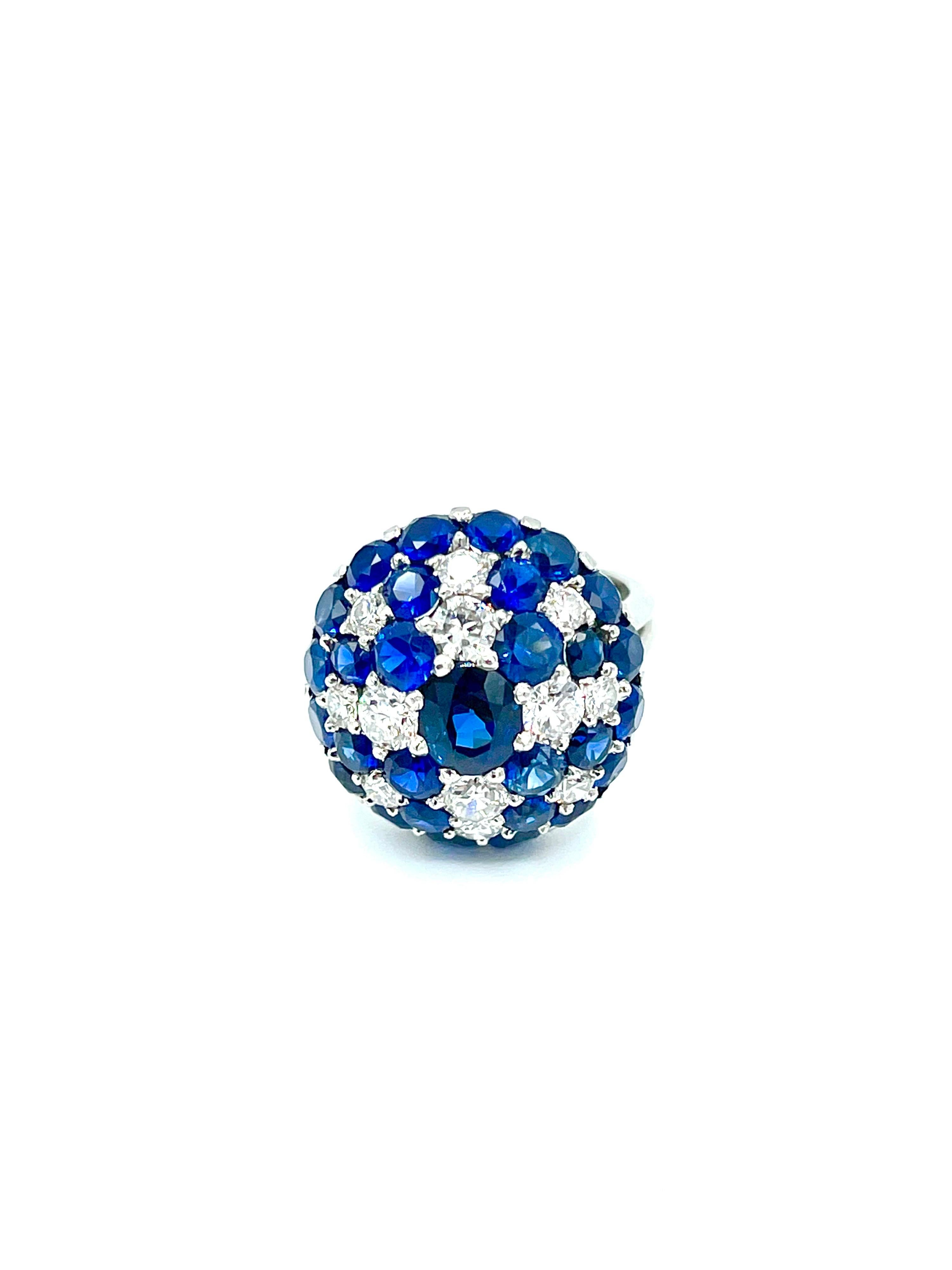This ring is aggressively eye catching!  The 7.06 carats in sapphires have amazing color, and are all very well matched.  There is a combination of one oval center Sapphire, and the remaining 28 being round.  The 12 round brilliant cut Diamonds have