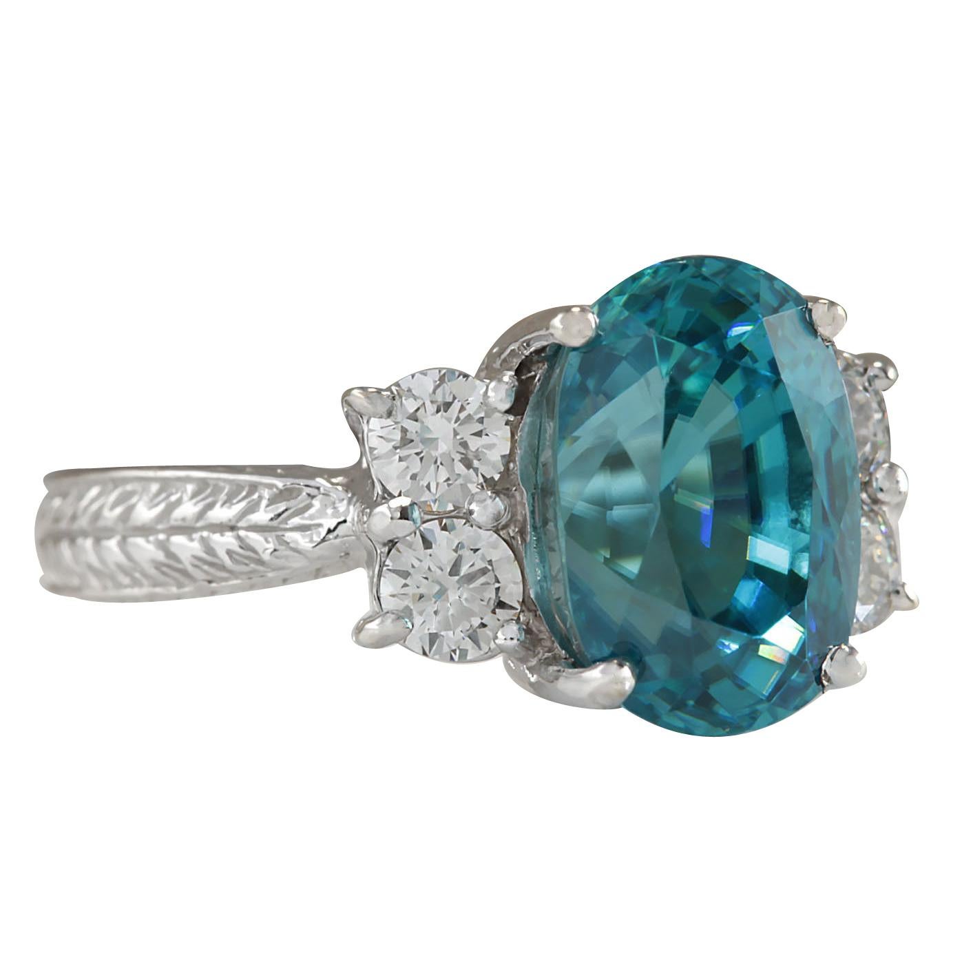 7.07 Carat Natural Zircon 14 Karat White Gold Diamond Ring
Stamped: 14K White Gold
Total Ring Weight: 6.2 Grams
Total Natural Zircon Weight is 6.47 Carat (Measures: 10.00x8.00 mm)
Color: Blue
Total Natural Diamond Weight is 0.60 Carat
Color: F-G,