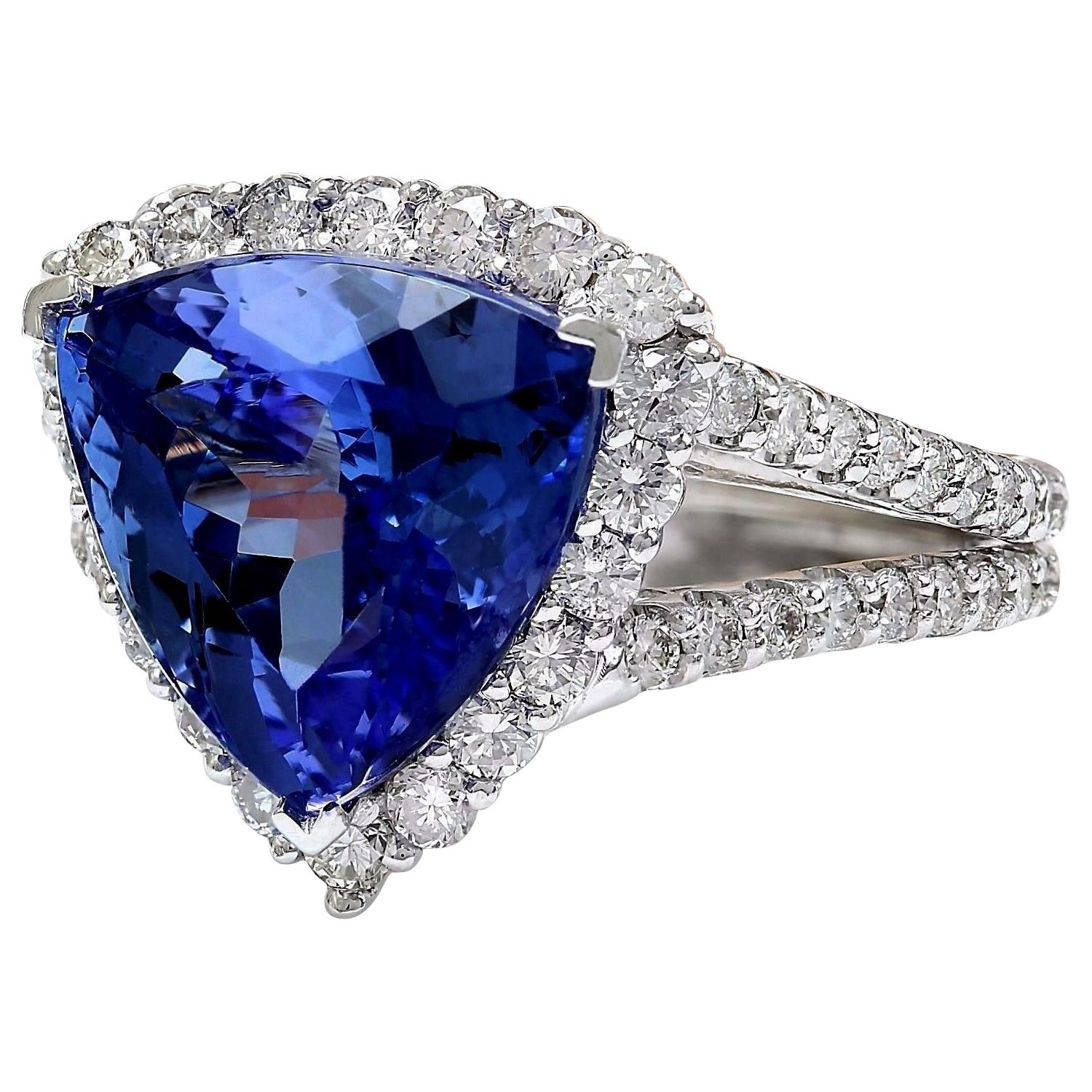 Introducing our stunning 7.07 Carat Tanzanite 14K Solid White Gold Diamond Ring. Crafted from luxurious 14K White Gold, this ring features a captivating trillion-cut Tanzanite weighing 5.41 carats, with dimensions of 11.00x11.00 mm, showcasing its
