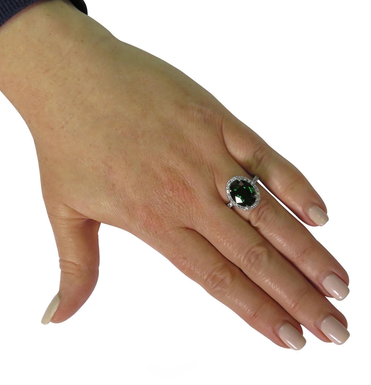 Modern 7.07 Carat Tsavorite and Diamond Halo Ring