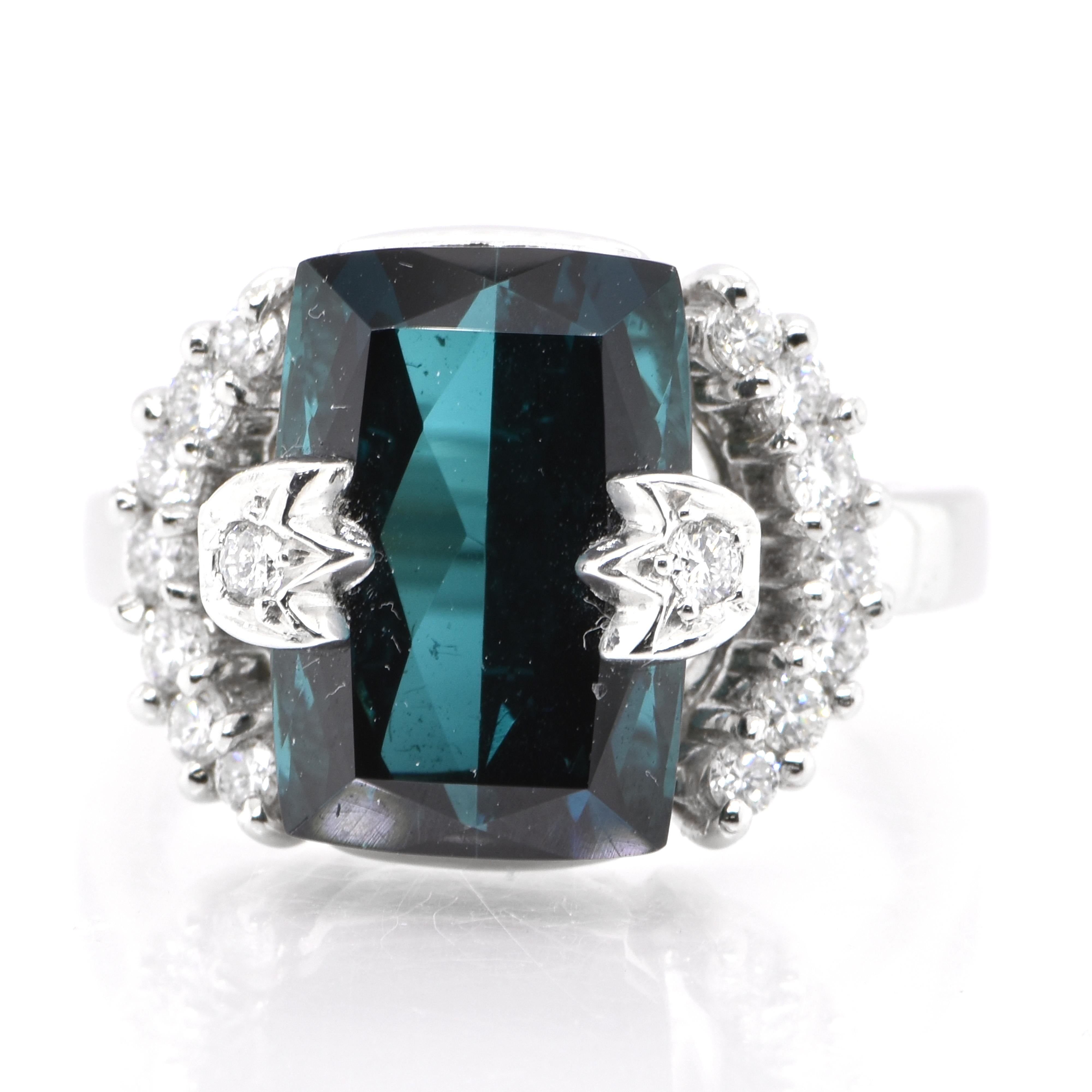 A stunning Cocktail Ring featuring a 7.07 Carat, Natural Blue Tourmaline and 0.46 Carats of Diamond Accents set in Platinum. Tourmalines were first discovered by Spanish conquistadors in Brazil in 1500s. The name Tourmaline comes from Sinhalese
