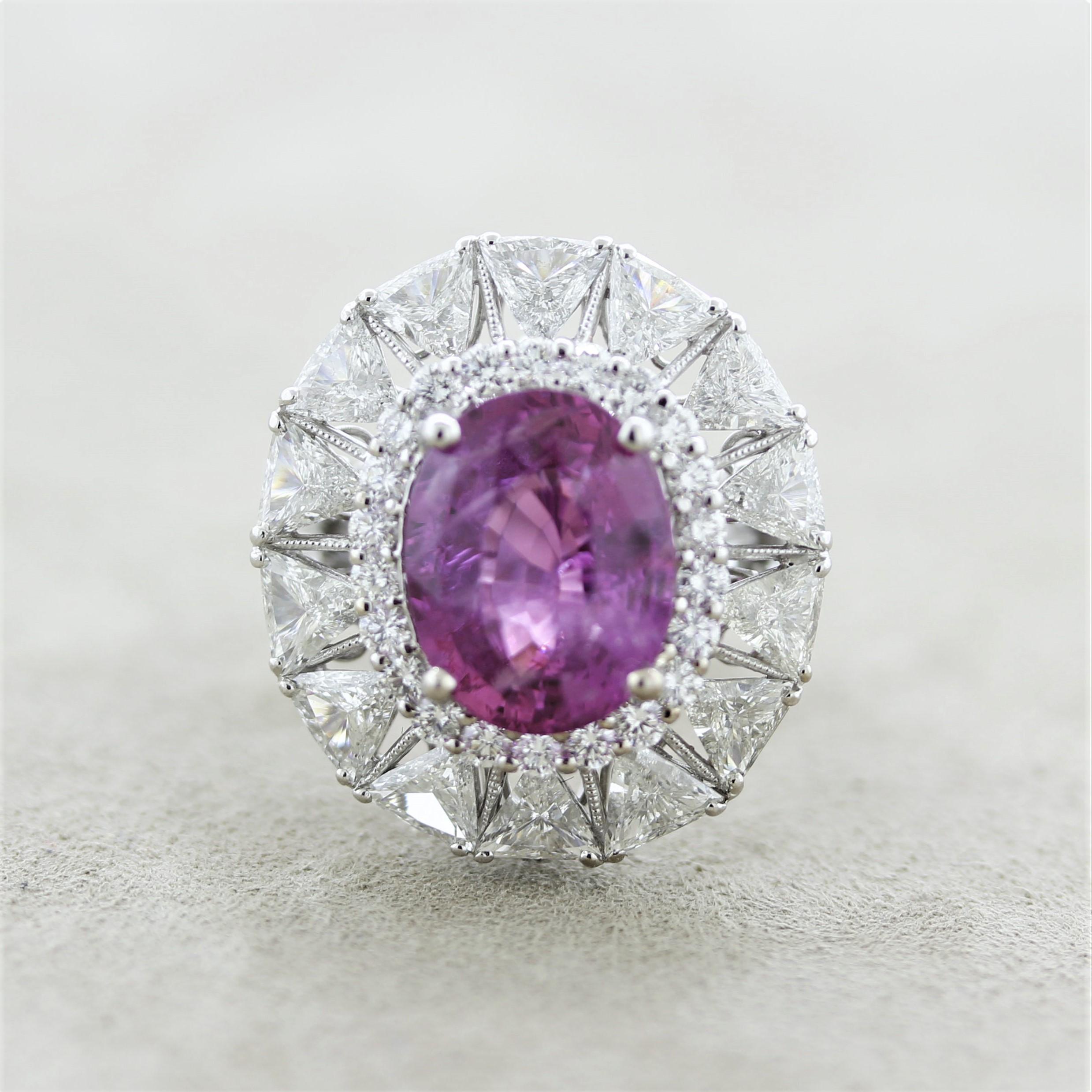 A large and rare fancy pink sapphire which has no indications of treatment of any kind, certified by the GIA. It weighs an impressive 7.08 carats and has a bright intense pink color and a lovely oval shape. It is complemented by 3 carats of