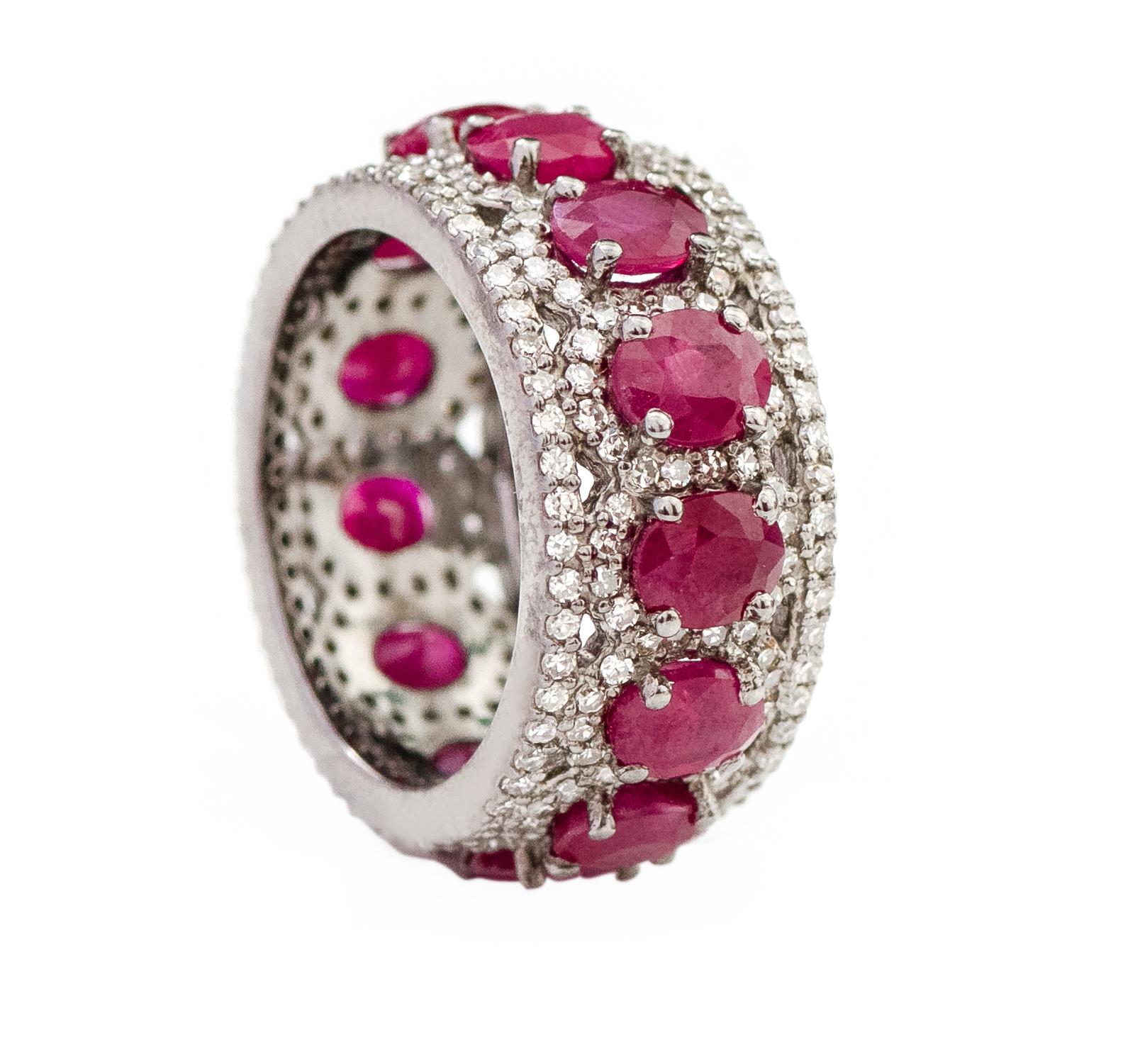 7.09 Carat Oval-Cut Ruby and Diamond Eternity Band Ring in Art-Deco Style

This Victorian period art-deco style immaculate vermillion red ruby and diamond band is phenomenal. The solitaire horizontally placed oval shape ruby in grain prong setting