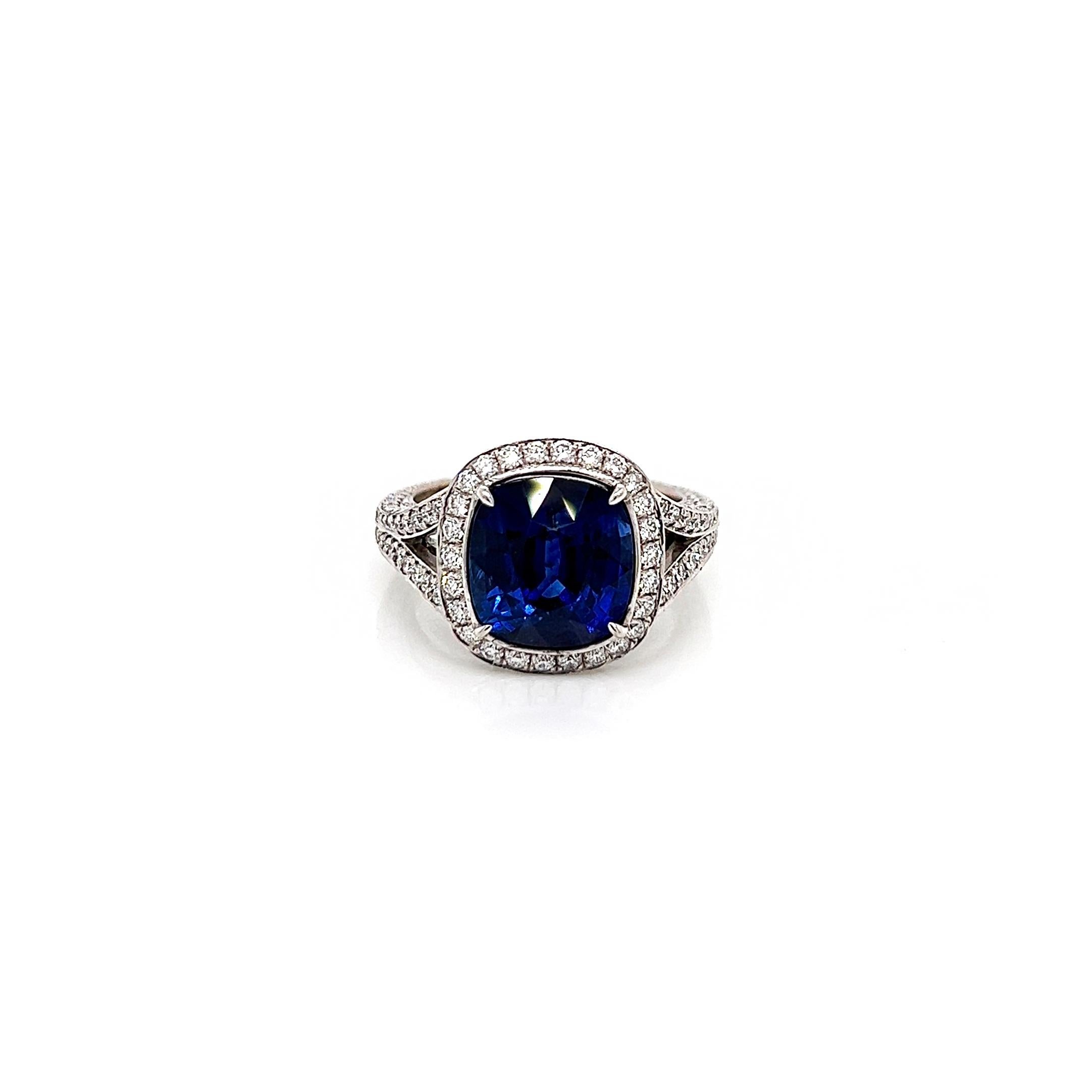 7.09 Total Carat Sapphire and Diamond Halo Pave-Set Ladies Engagement Ring

-Metal Type: 18K White Gold
-5.41 Carat Cushion Cut Natural Blue Sapphire
-1.68 Carat Round Natural Diamonds. F-G Color, VS1-VS2 Clarity 

-Size 6.75

Made in New York City.

