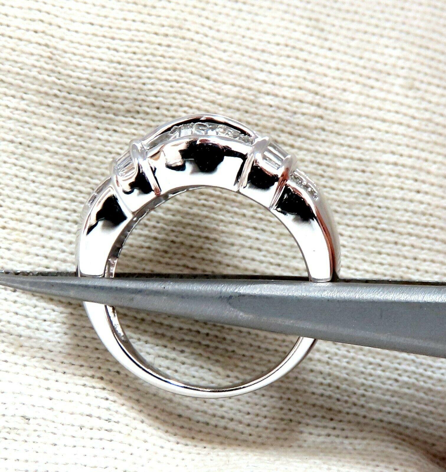 .70ct. Baguette diamond band. 

H color, Si-1 clarity.
14kt. White gold.

9.2mm thick 

Size 5 3/4