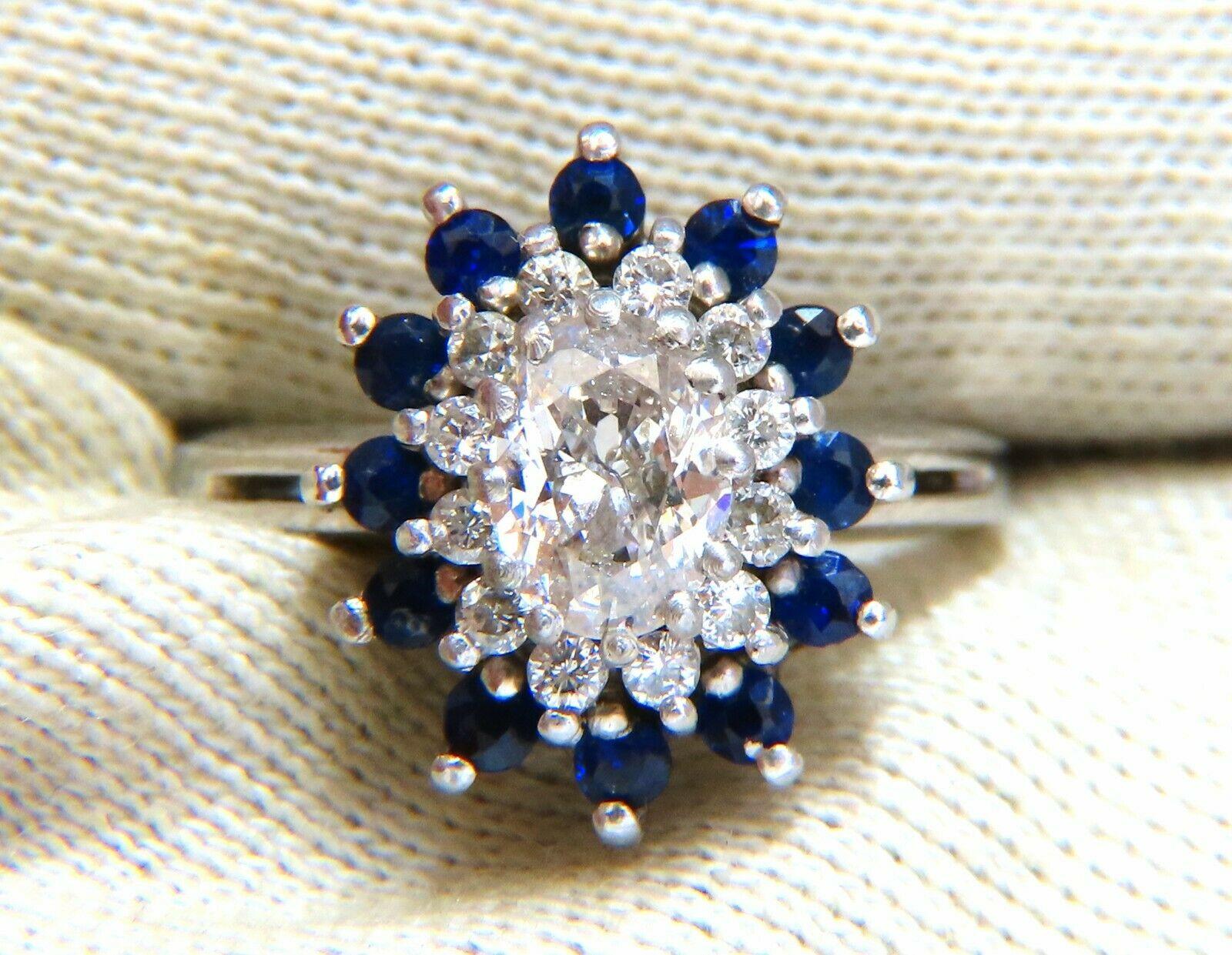 Sapphire & Diamonds Cluster Ring

.70ct Natural Oval Diamond

Full cut and Full Faceted.

I-color Si-2 clarity.

.70ct natural sapphires on sides

.30ct Natural Round Diamonds

H-color Si-1 Si-2 Clarity

8.4 grams 

Ring is 13 x 16mm.

Depth: