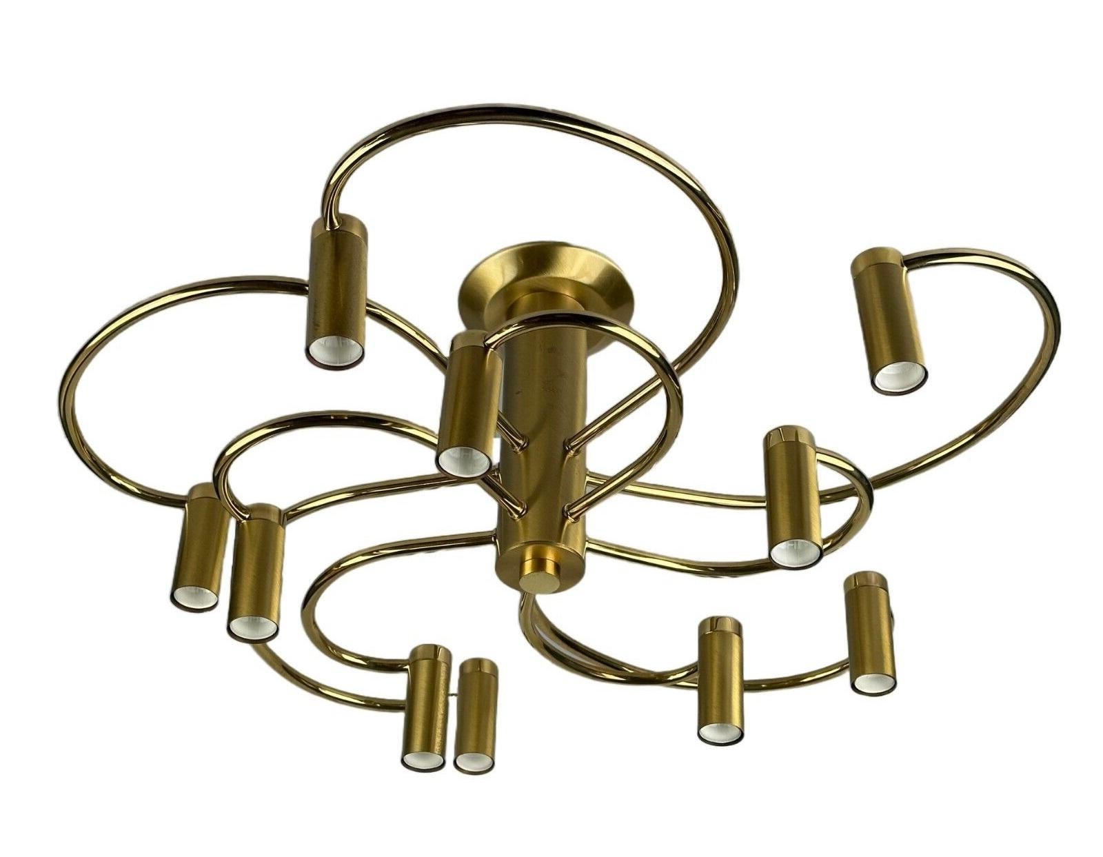 70s 80s Sputnik ceiling lamp by Vielhaber Leuchten Germany brass

Object: ceiling lamp

Manufacturer: Vielhaber lights

Condition: good

Age: around 1970-1980

Dimensions:

Width = 63cm
Depth = 63cm
Height = 26cm

Other notes:

10x E14 socket

The