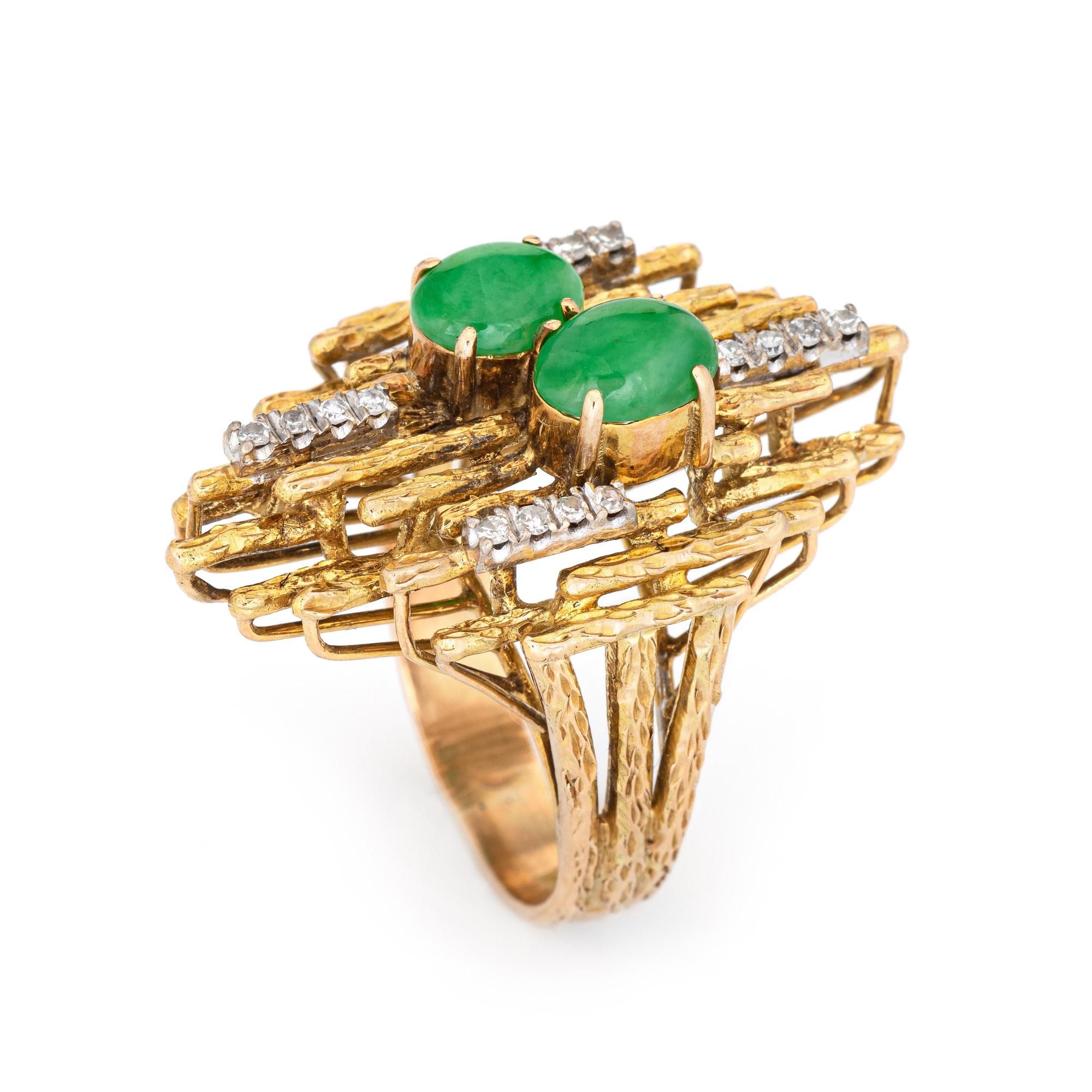 Stylish vintage abstract jade & diamond ring (circa 1970s) crafted in 14 karat yellow gold. 

Jade cabochons are estimated at 1 carat each (2 carats total estimated weight). Diamonds total an estimated 0.10 carats (estimated at H-I color and VS2-I2