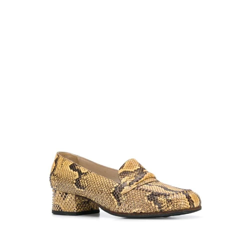 Artioli 70s sand-color and brown pythonskin loafers. Square toe and low heel.

Size: 36.5 EU

Heel: 3,5 cm
Insole length: 23,5 cm

Product code: A8119

Composition: Pythonskin

Made in: Italy

Condition: Very good conditions