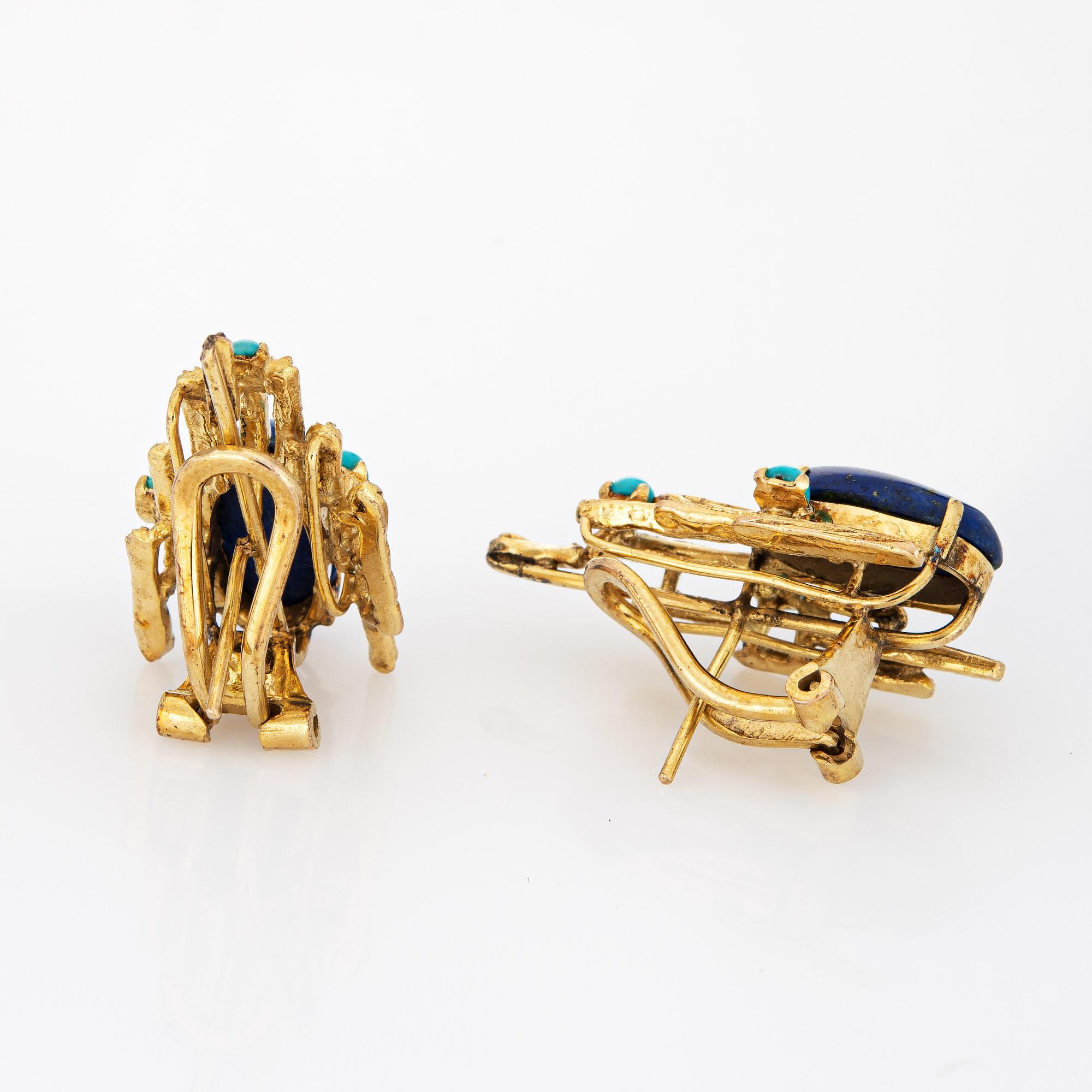 Stylish vintage Brutalist turquoise & lapis earrings (circa 1970s) crafted in 14 karat yellow gold. 

Cabochon cut lapis lazuli measures 15mm x 8mm (estimated at 5 carats - 10 carats total), accented with 3.5mm pieces of turquoise. The lapis &