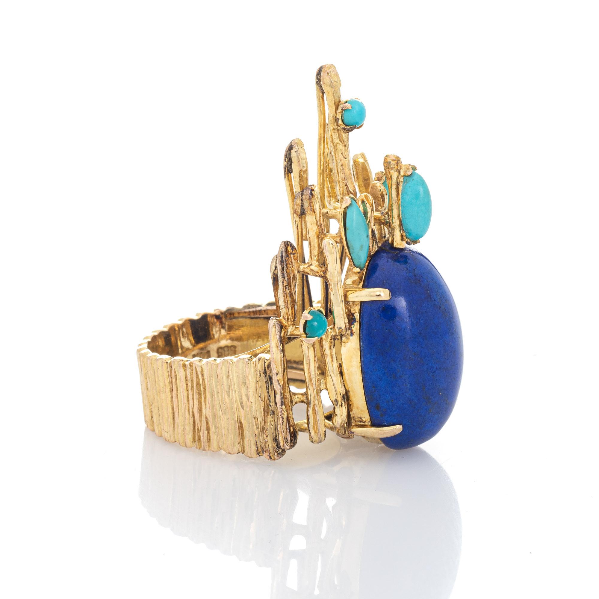 Stylish vintage Brutalist turquoise & lapis cocktail ring (circa 1970s) crafted in 14 karat yellow gold. 

Cabochon cut lapis lazuli measures 21.5mm x 14.5mm (estimated at 16 carats), accented with turquoise measuring 3.5mm to 7mm x 3mm. The lapis &