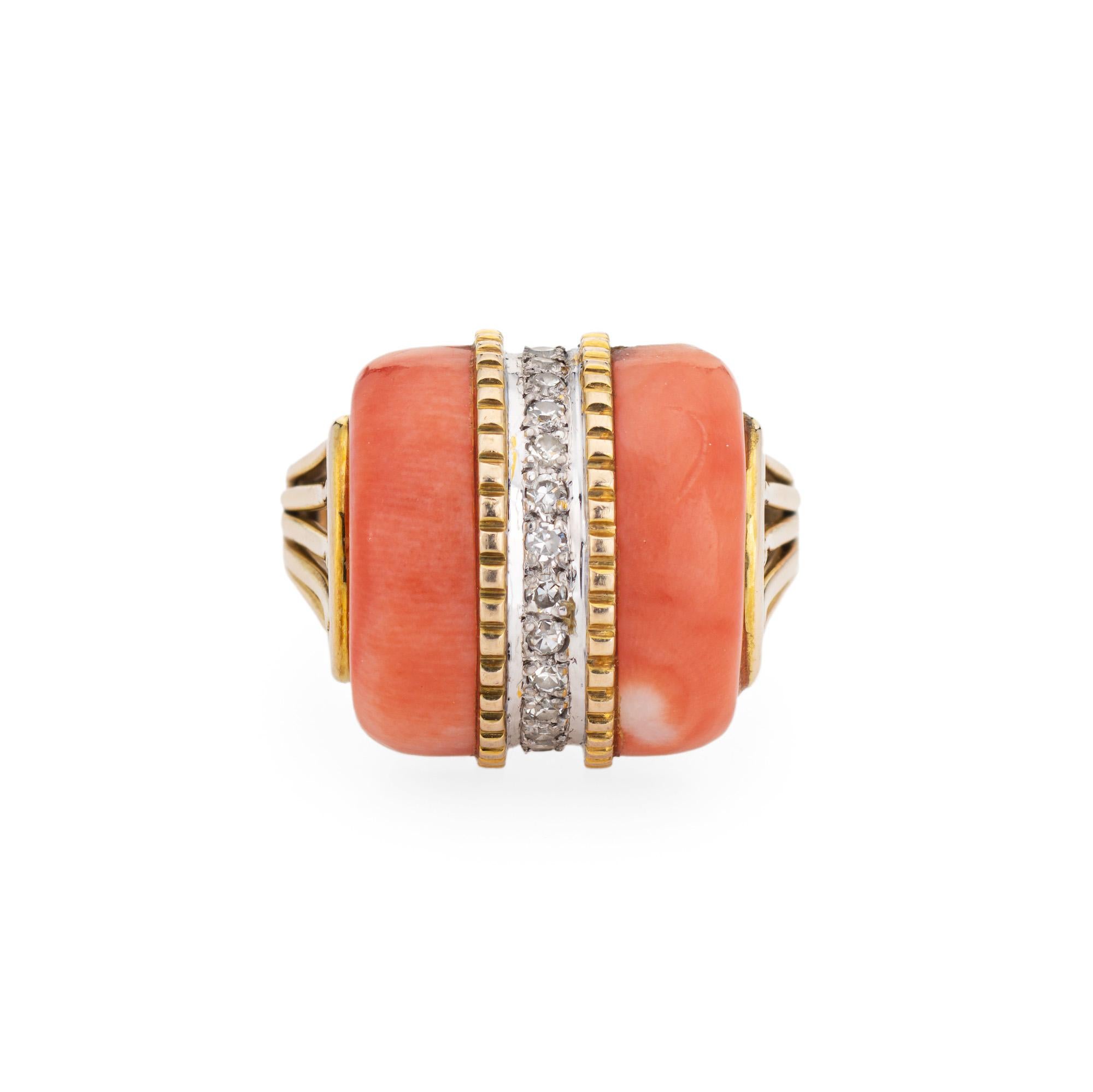 Stylish coral & diamond dome ring crafted in 14 karat yellow gold (circa 1970s). 

Cabochon cut coral measures 23mm x 4mm. 14 single cut diamonds total an estimated 0.07 carats (estimated at H-I color and SI1-I1 clarity). The coral is in very good