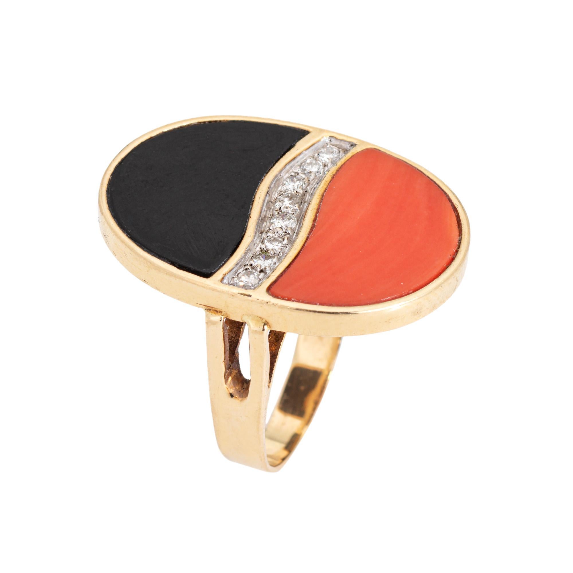 Finely detailed vintage coral & onyx cocktail ring (circa 1970s) crafted in 14k yellow gold. 

Onyx & coral measures 16mm x 9mm. Diamonds total an estimated 0.05 carats (estimated at H-I color and SI1-I1 clarity). The onyx and coral are in very good