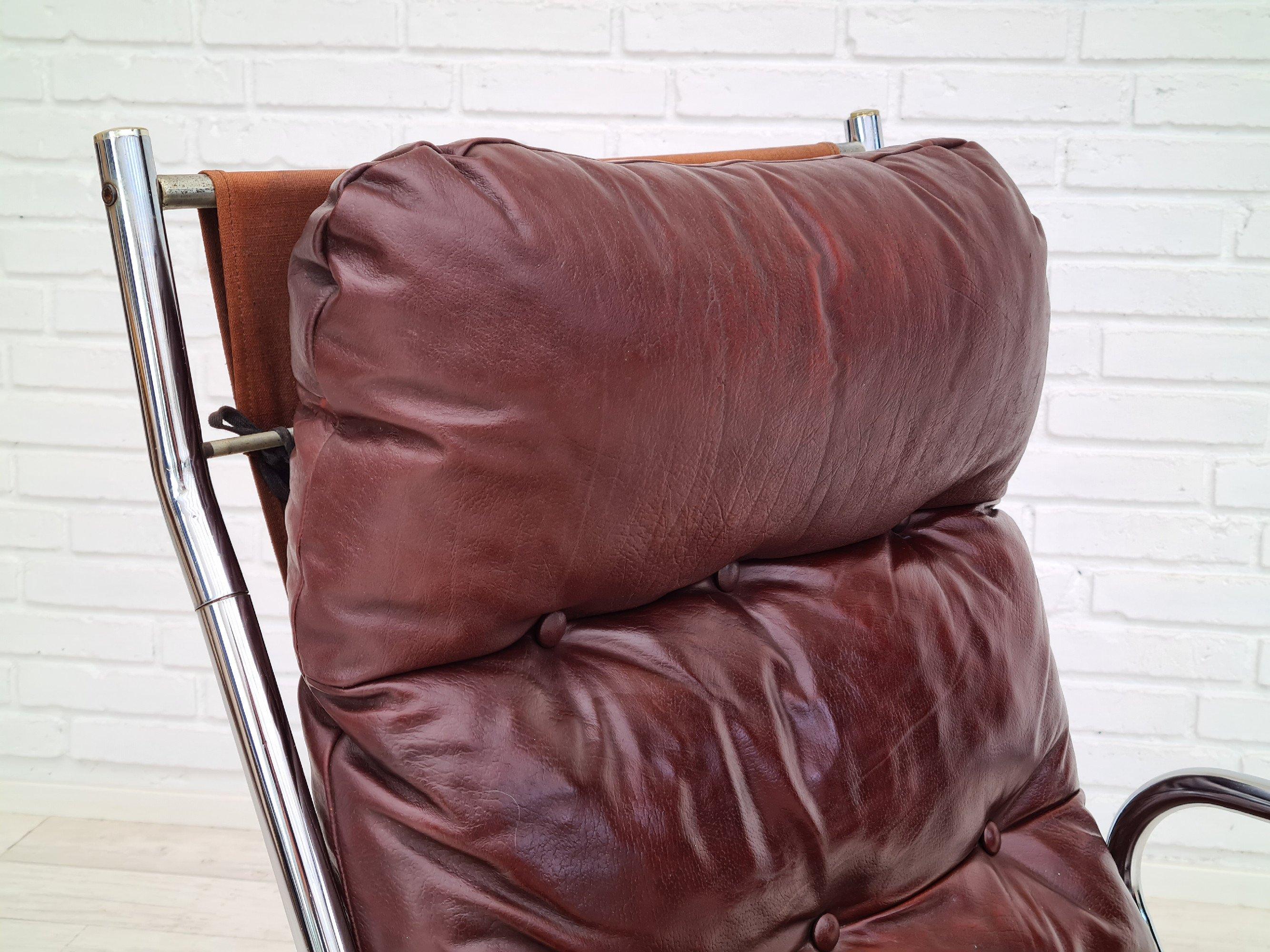 70s, Danish design, lounge chair, leather, original condition. Original brown leather in good condition with nice patina. Canvas tied. Armrest of brown leather, tubes, chrome steel. Removable pillows. No smells, do not smoke. The chair was