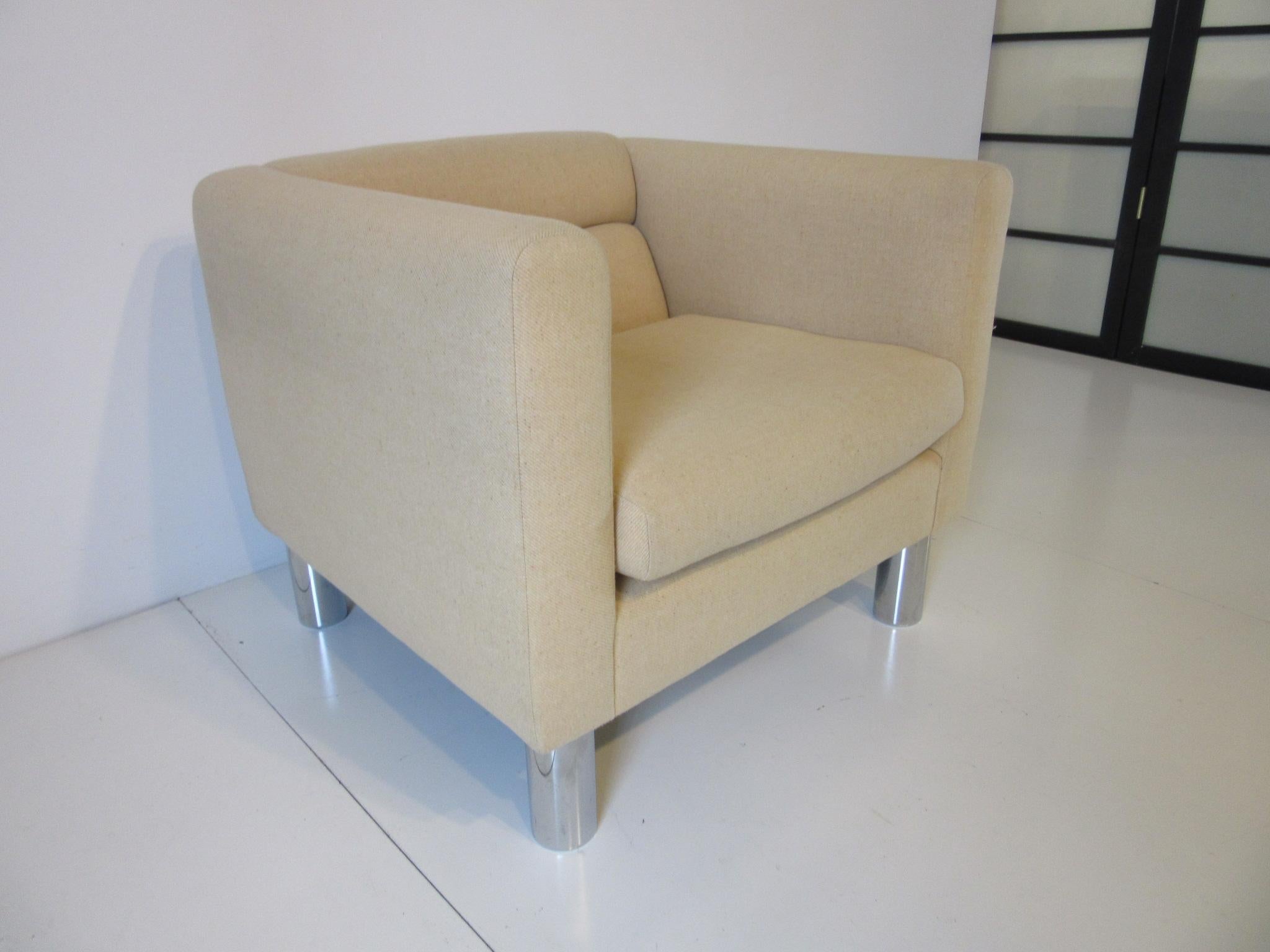 A vintage 1970s cube styled upholstered side chair in a wool blend fabric with fitted back and loose bottom cushion sitting on chrome round metal tube shaped legs. Retains the original labels and ticking by David Edward Furniture LTD, a comfortable,