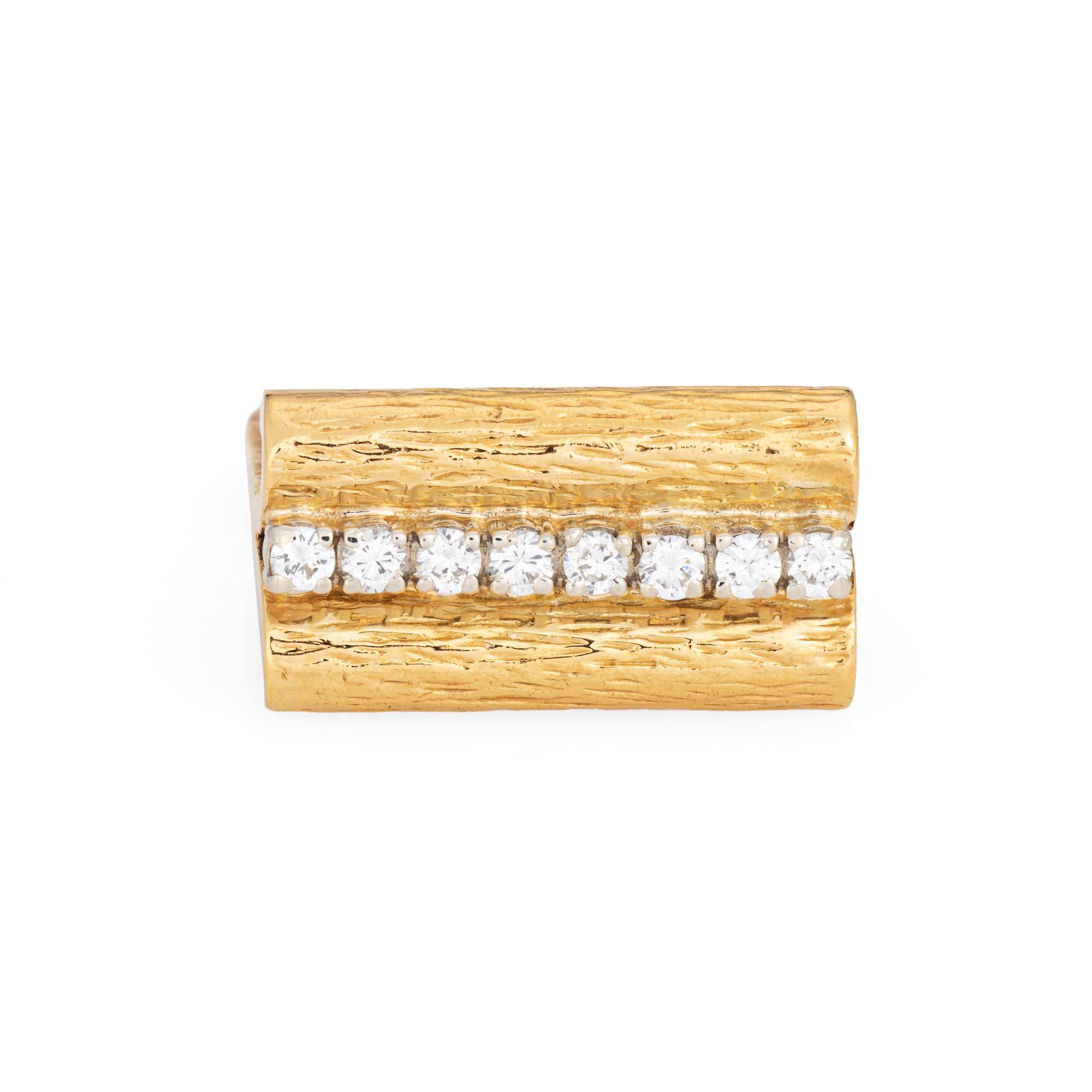 Stylish diamond square band crafted in 14 karat yellow gold (circa 1970s). 

Diamonds total an estimated 0.16 carats (estimated at H-I color and VS2-SI1 clarity).  

The distinct textured square band makes a great statement on the hand, designed in