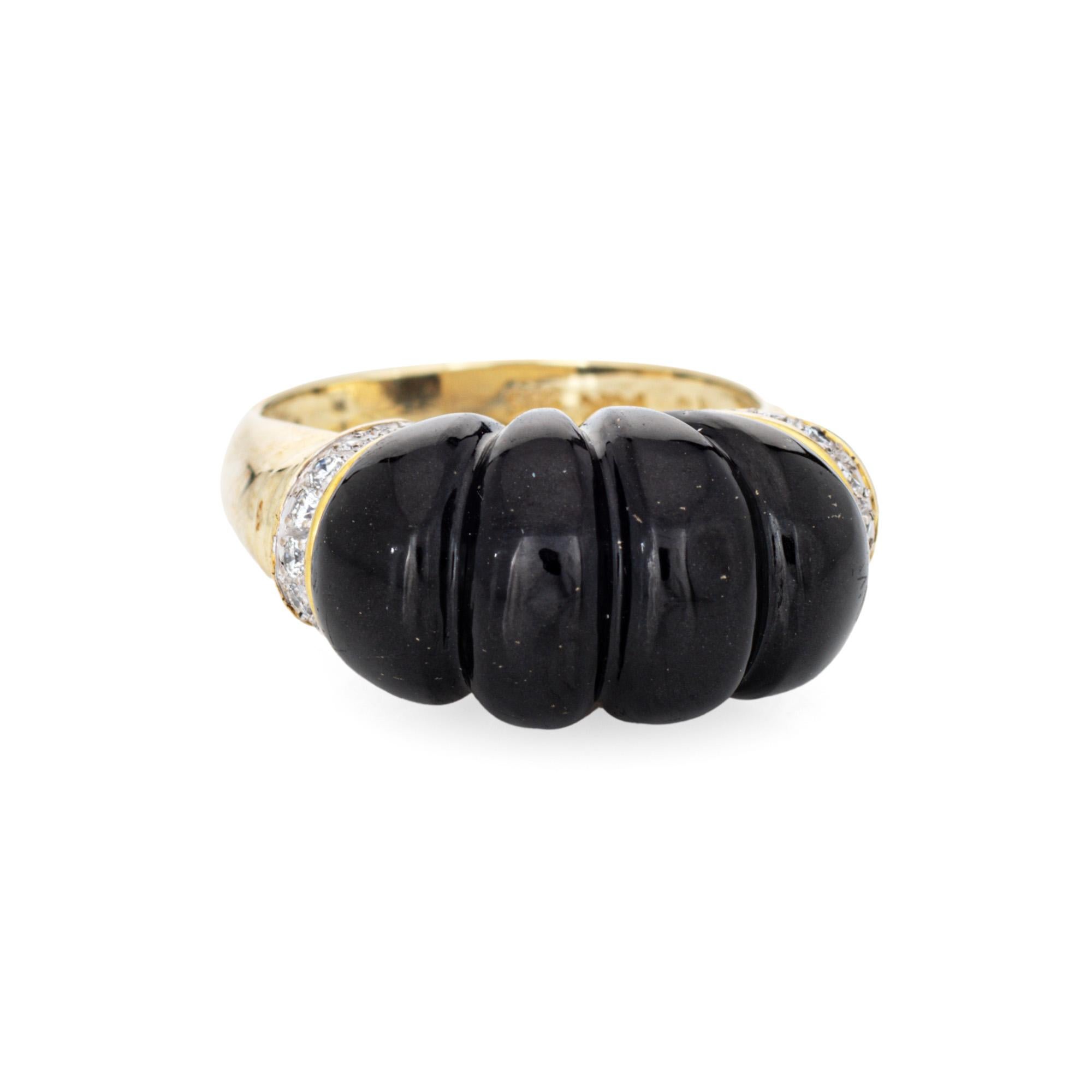 Stylish vintage fluted onyx & diamond ring (circa 1960s to 1970s) crafted in 14 karat yellow gold. 

Fluted onyx measures 17mm x 10.5mm. Diamonds total an estimated 0.10 carats (estimated at H-I color and SI2-I2 clarity). The onyx is in very good