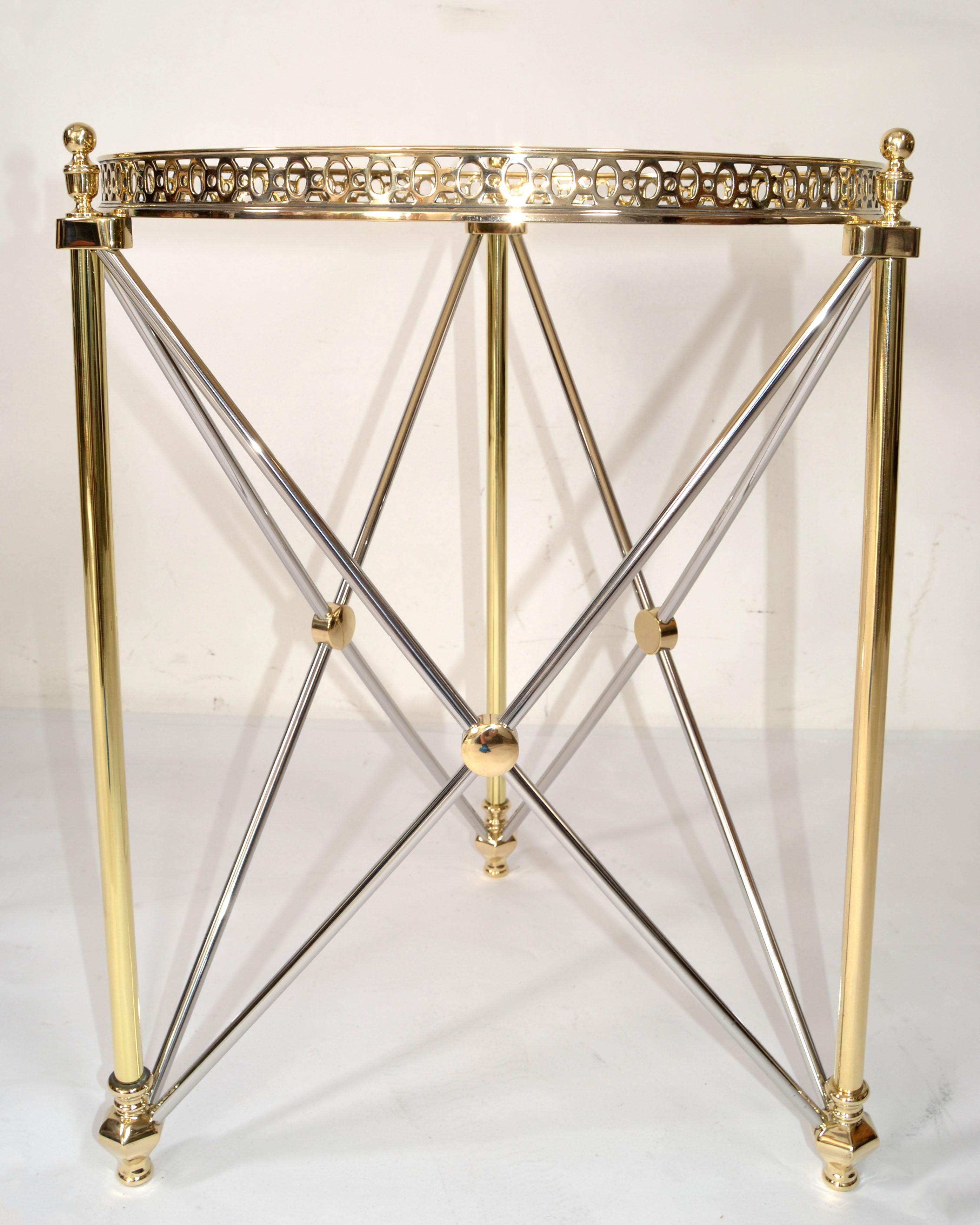 Mid-Century Modern French Maison Jansen Style Brass, Chrome Side, End or Drink Table with attached round Tray Top. 
Brass Finial Decor at the Center where the sculptural Base and Top frame connects.
The silver stretchers are made out of Chrome and