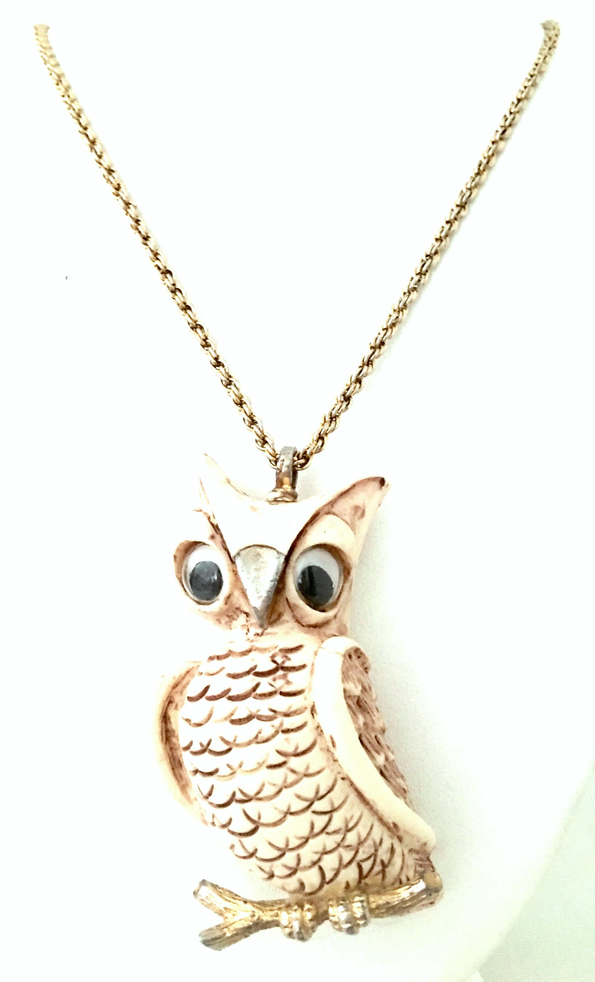 1970'S Gold & Resin Owl pendant Necklace By. Lucca Razza. The large own pendant is sculpted from resin composite with plastic eyes and gold plate in the beak, bale and lower faux bois branch. This rare and coveted piece Includes a 36.5