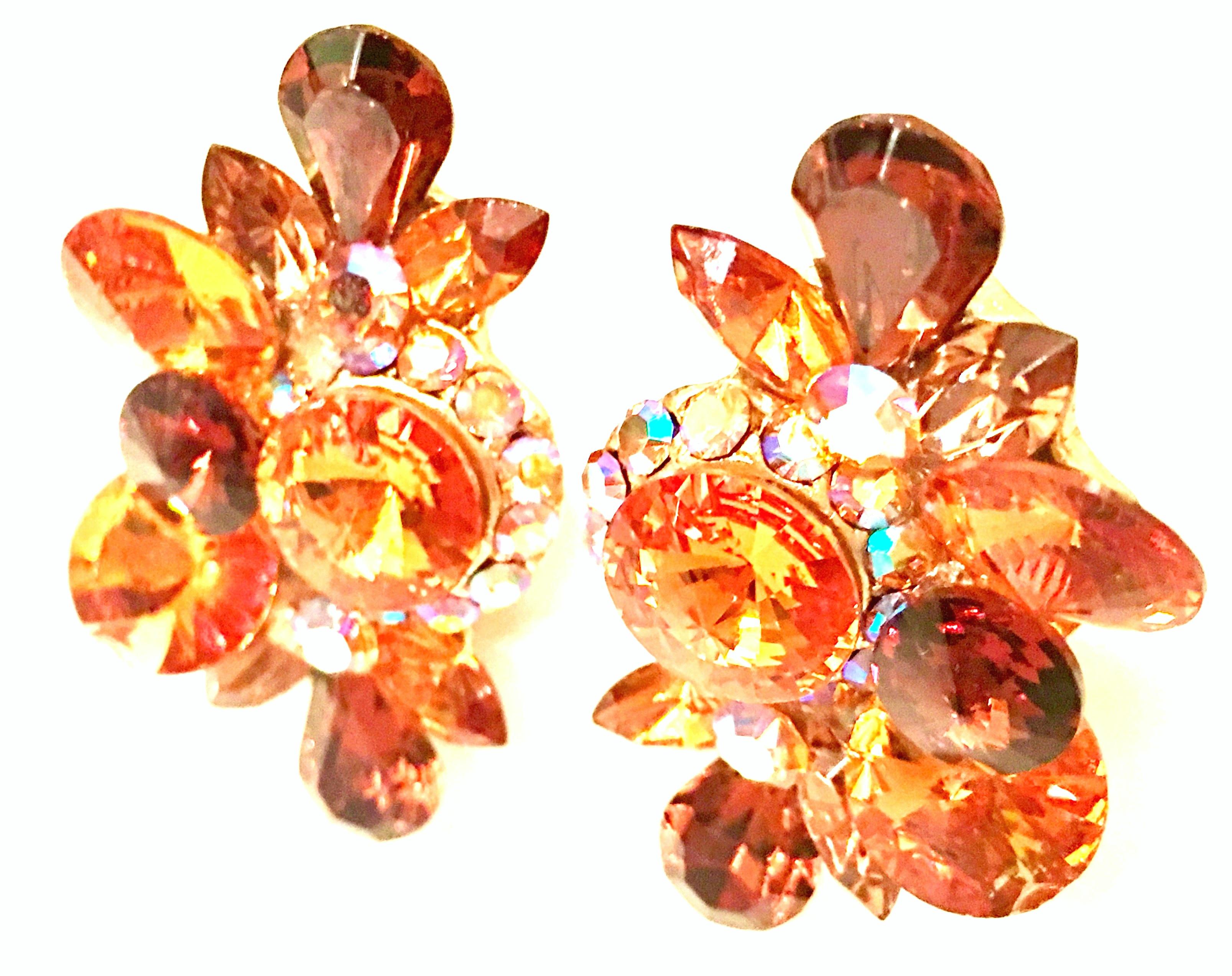 20th Century Pair Of Gold & Austrian Crystal Earrings By, Delizza & Elster. Features gold plate brilliant cut and faceted citrine, topaz and Aurora Borealis crystal stones. These clip style earrings are designed with a 