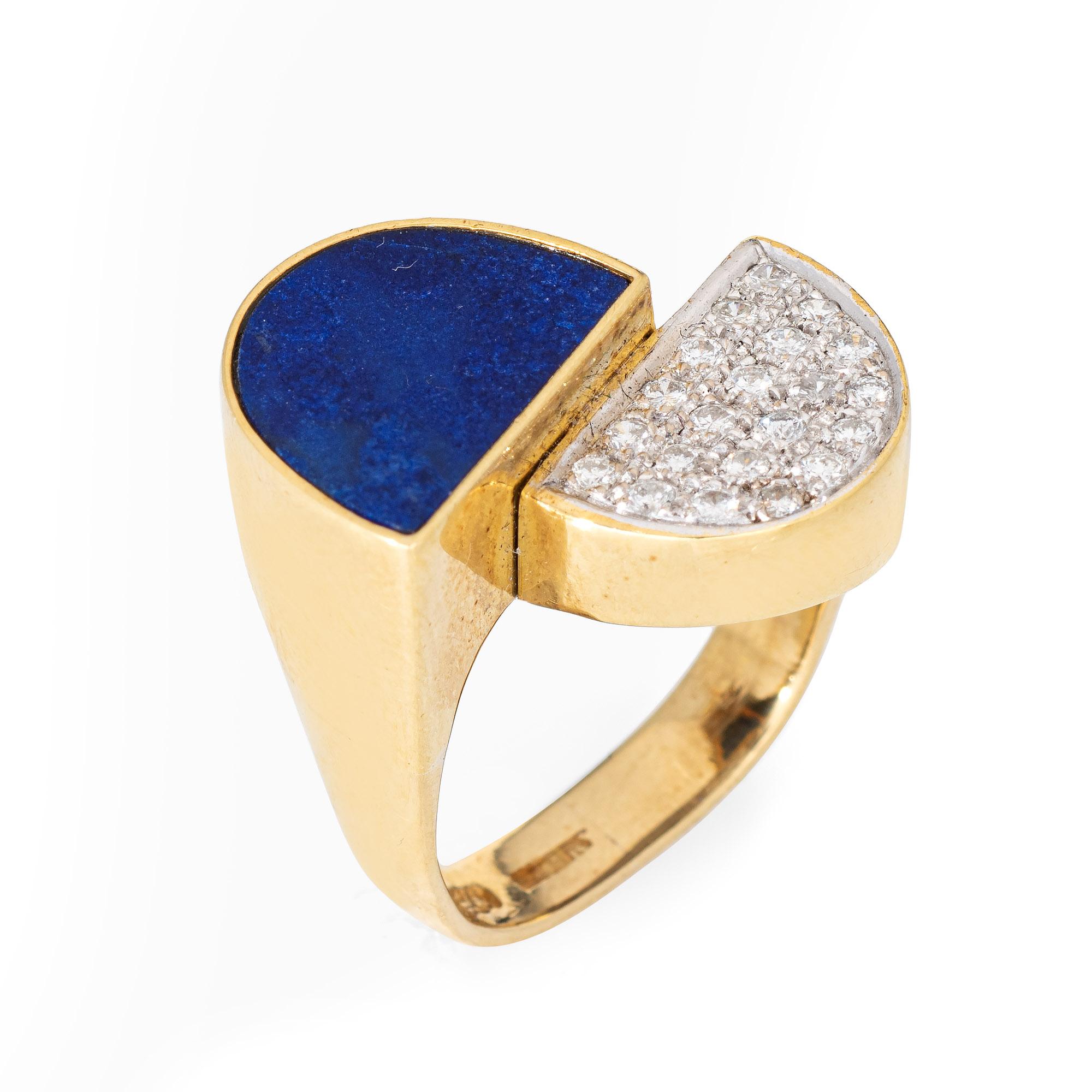 Distinct and stylish lapis lazuli & diamond 'half moons' ring crafted in 18 karat yellow gold (circa 1970s). 

Inlaid lapis lazuli measures 12mm x 9mm. Pave set diamonds total an estimated 0.21 carats (estimated at H-I color and VS2-SI2 clarity).