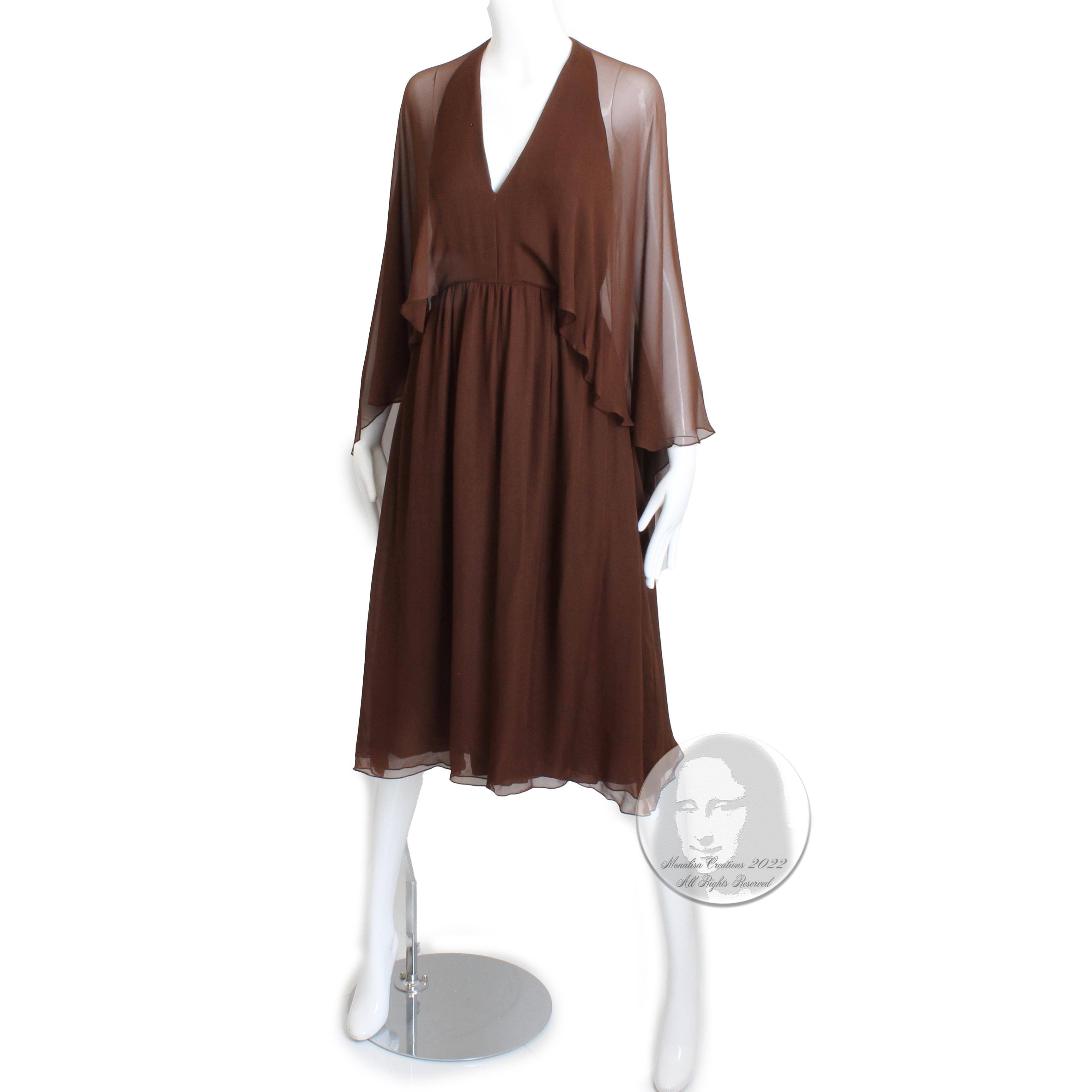 This fabulous Halston halter dress is from 1975 and has an ethereal quality with its attached sheer shawl that can be worn as angel sleeves or pushed around the neck, shawl-style.  Fully-lined, it fastens in back with a zipper and several hidden