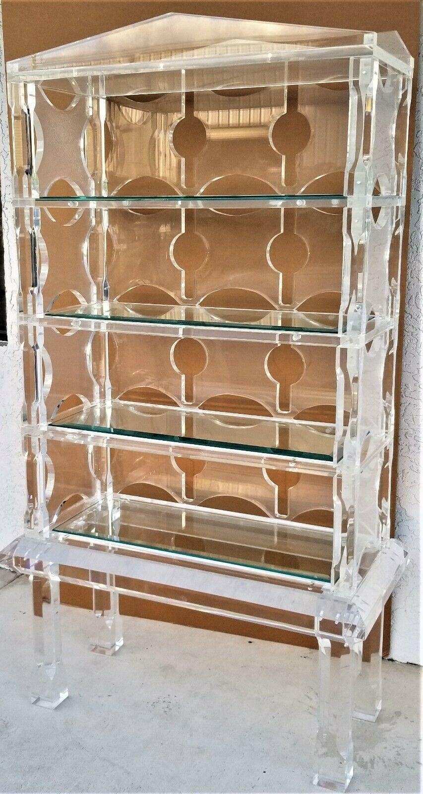 Offering One Of Our Recent Palm Beach Estate Fine Furniture Acquisitions Of A Custom Made 1970's Exceptional Huge MCM Neo-Classical Hollywood Regency Style Lucite Display Etagere Bookcase Shelves 
Featuring 4 (but removable) thick glass shelves. It