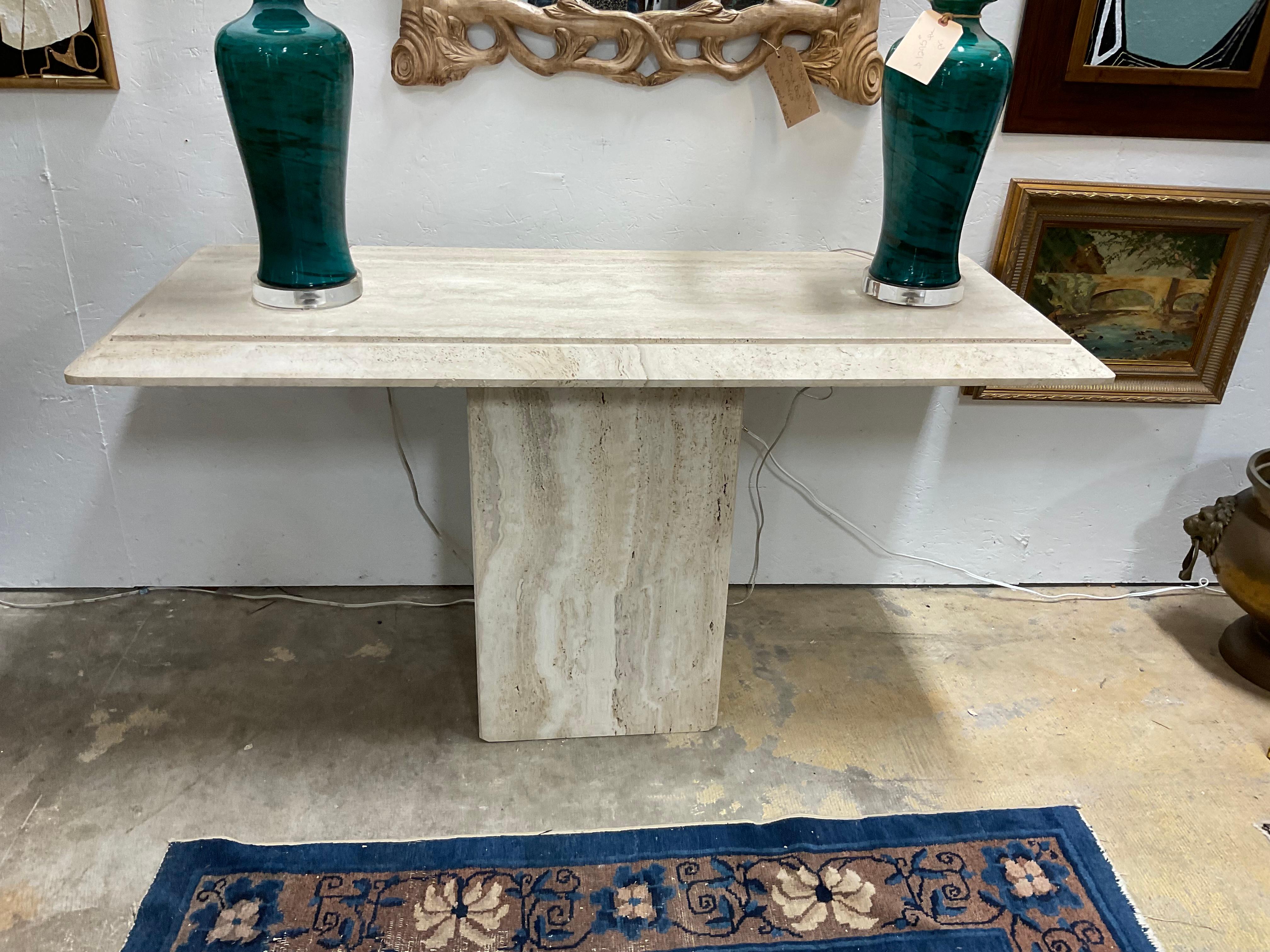 Handsome travertine console, made in Italy.  Great neutral colors, with high style. Simple lines,  that can elevate any number of styles. 