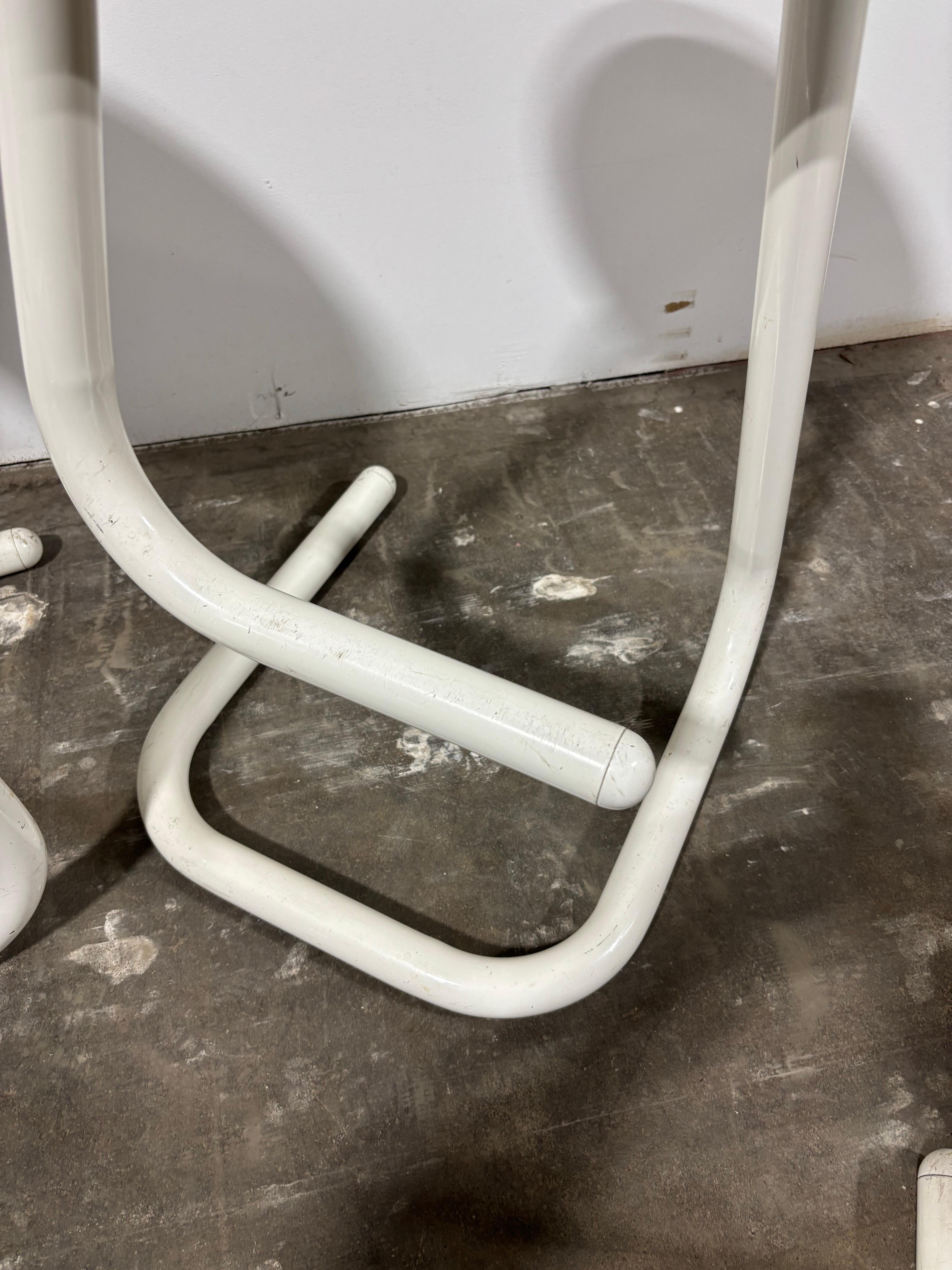 Set of 4 Paperclip Stools, measuring 21.5 high with a 12.5 round seat.  Clever Design that sits very solid and has a great fun look!  Designed by Hugh Hamilton and Philip Salmon for Kinetics of Canada.  Original paint looks pretty good, still nice